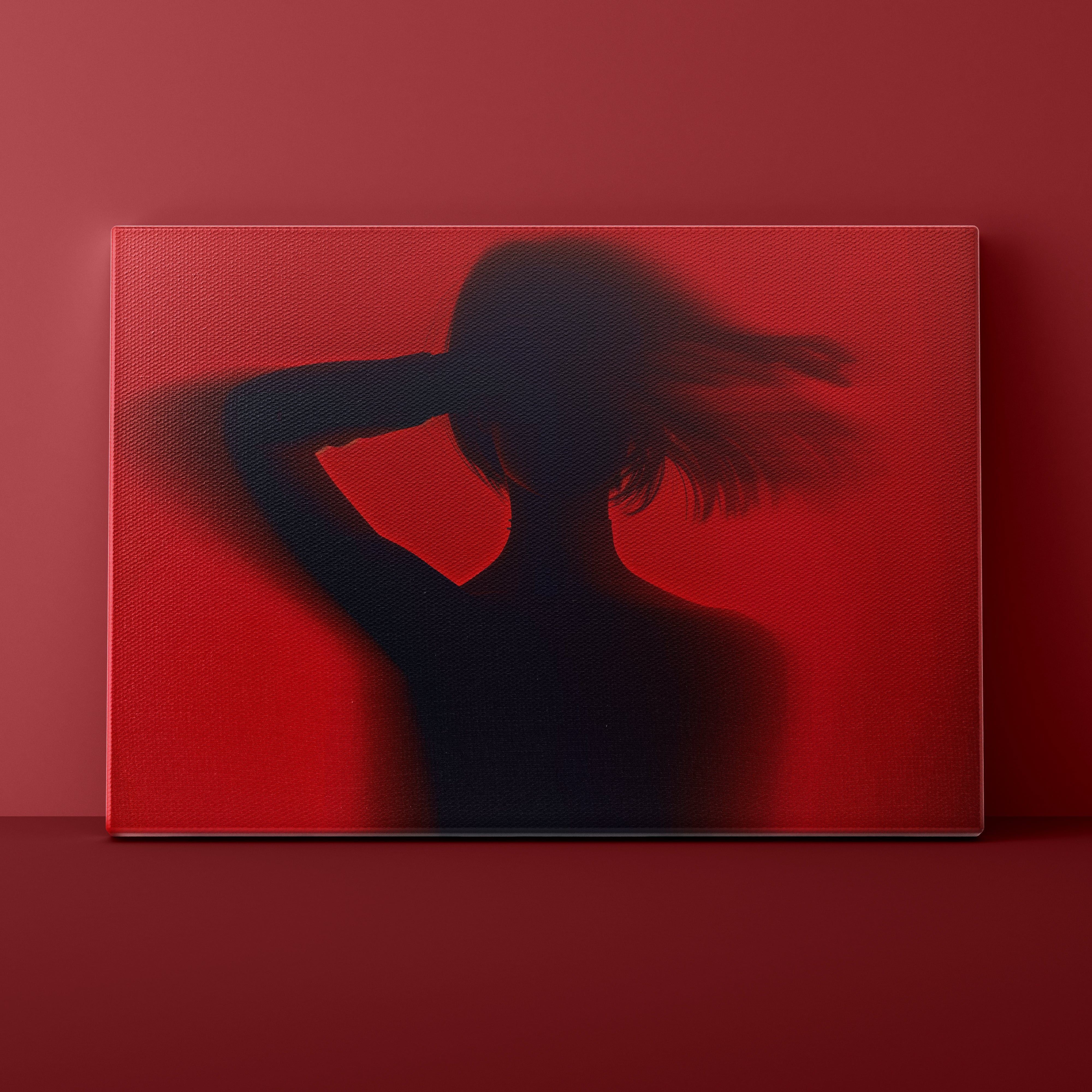 Silhouette of a person against a red background