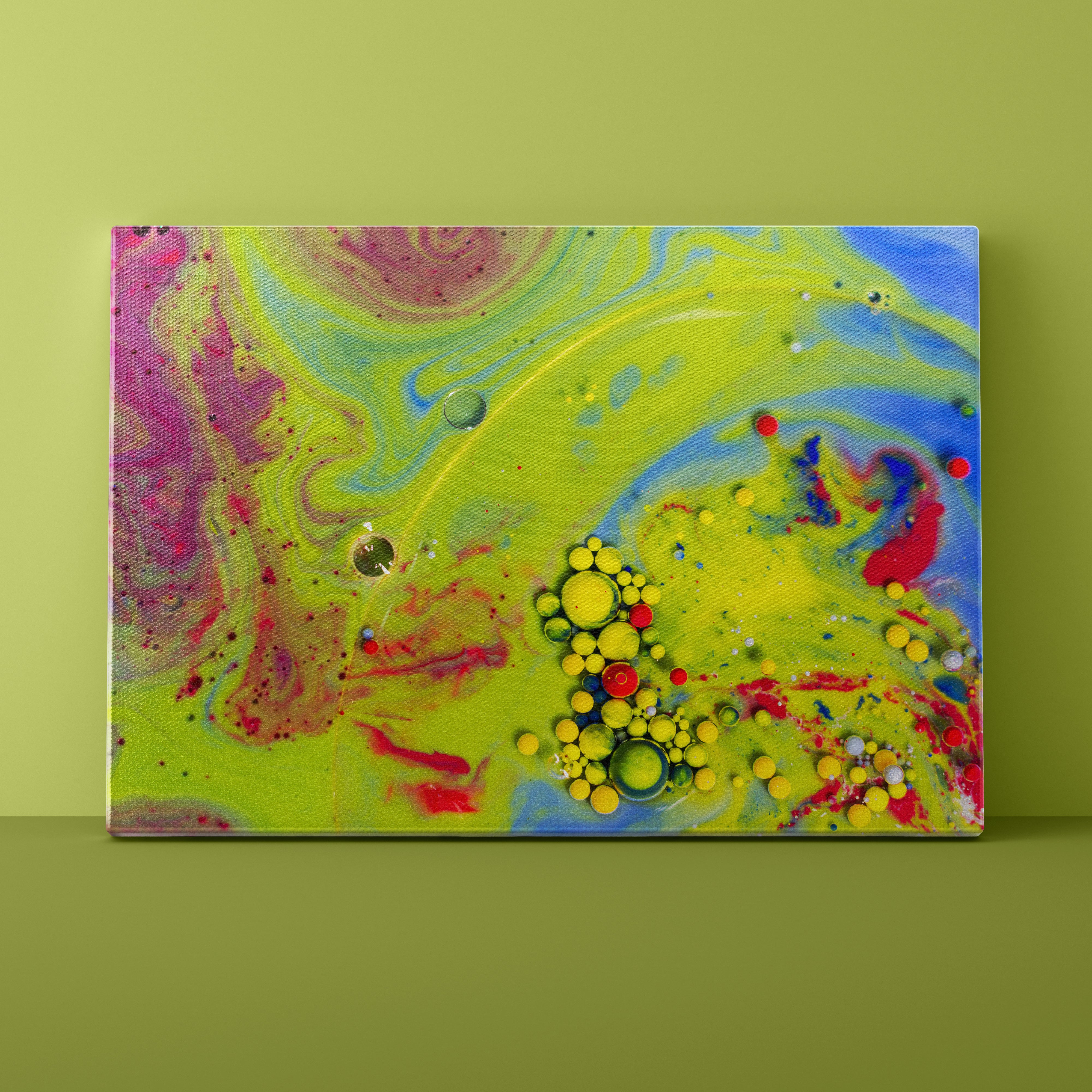 Abstract art canvas with colorful swirls and bubbles on a green background