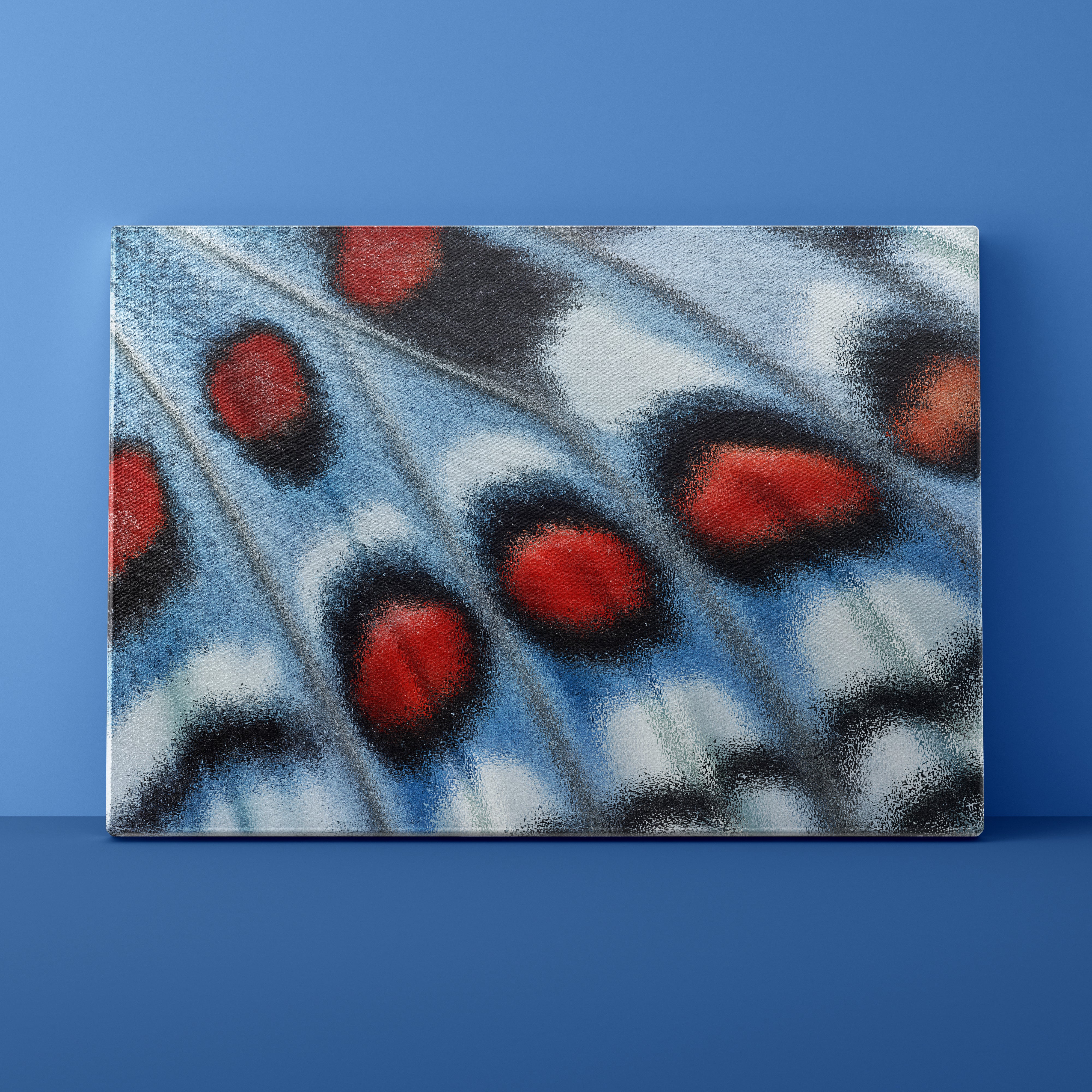 Close-up of a butterfly wing with red and black spots on a blue background