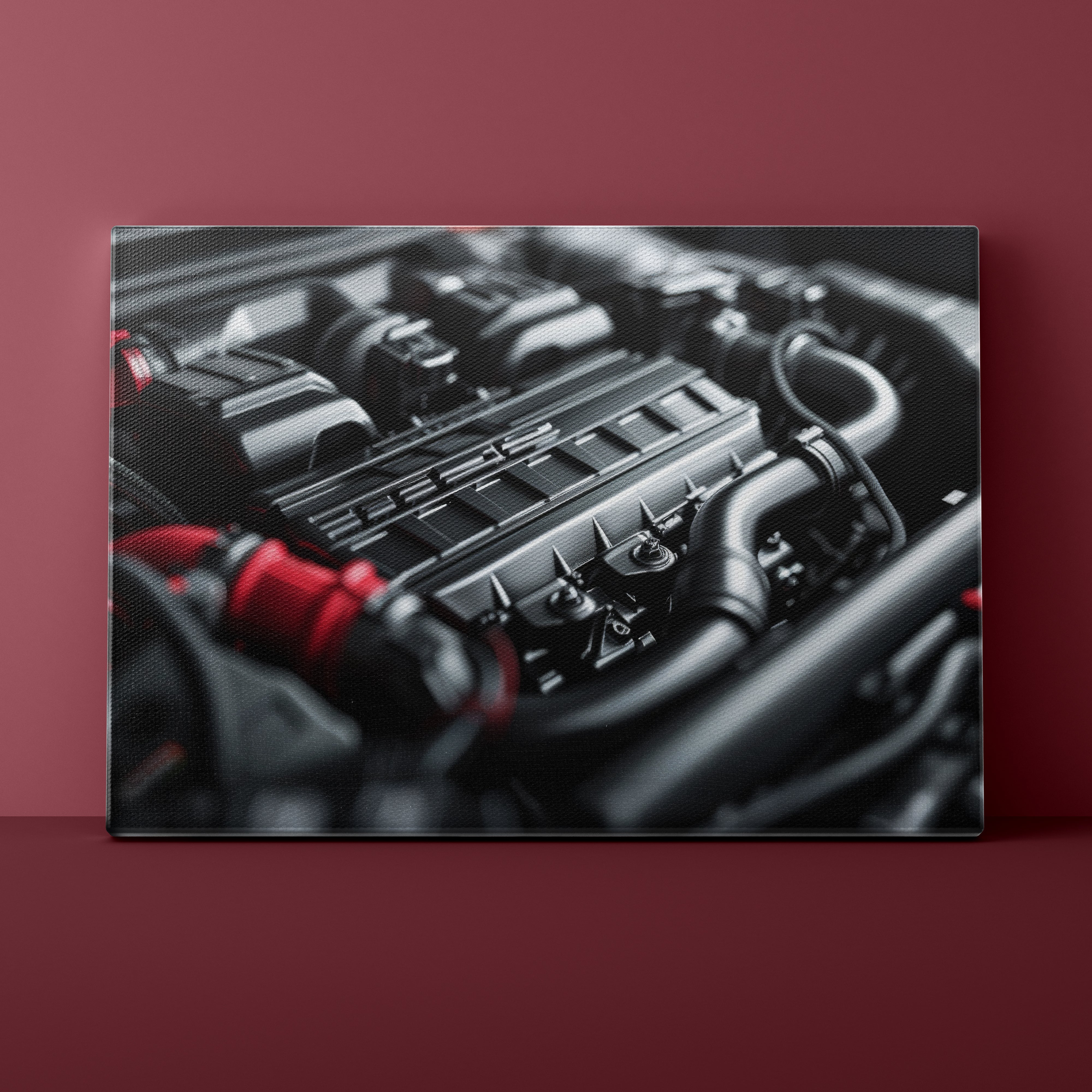 Close-up of a car engine on a red background