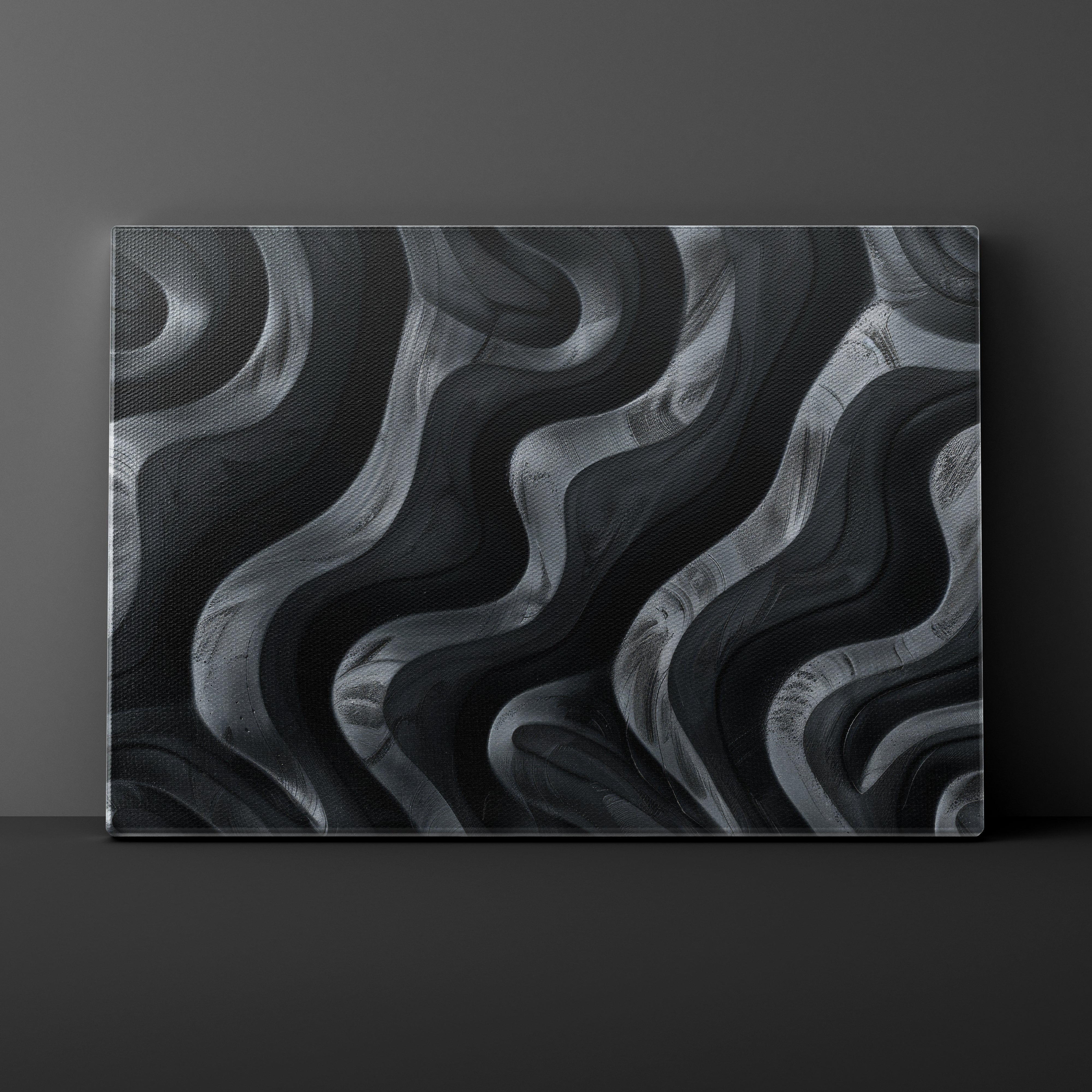 Abstract black and gray wavy pattern on a dark background