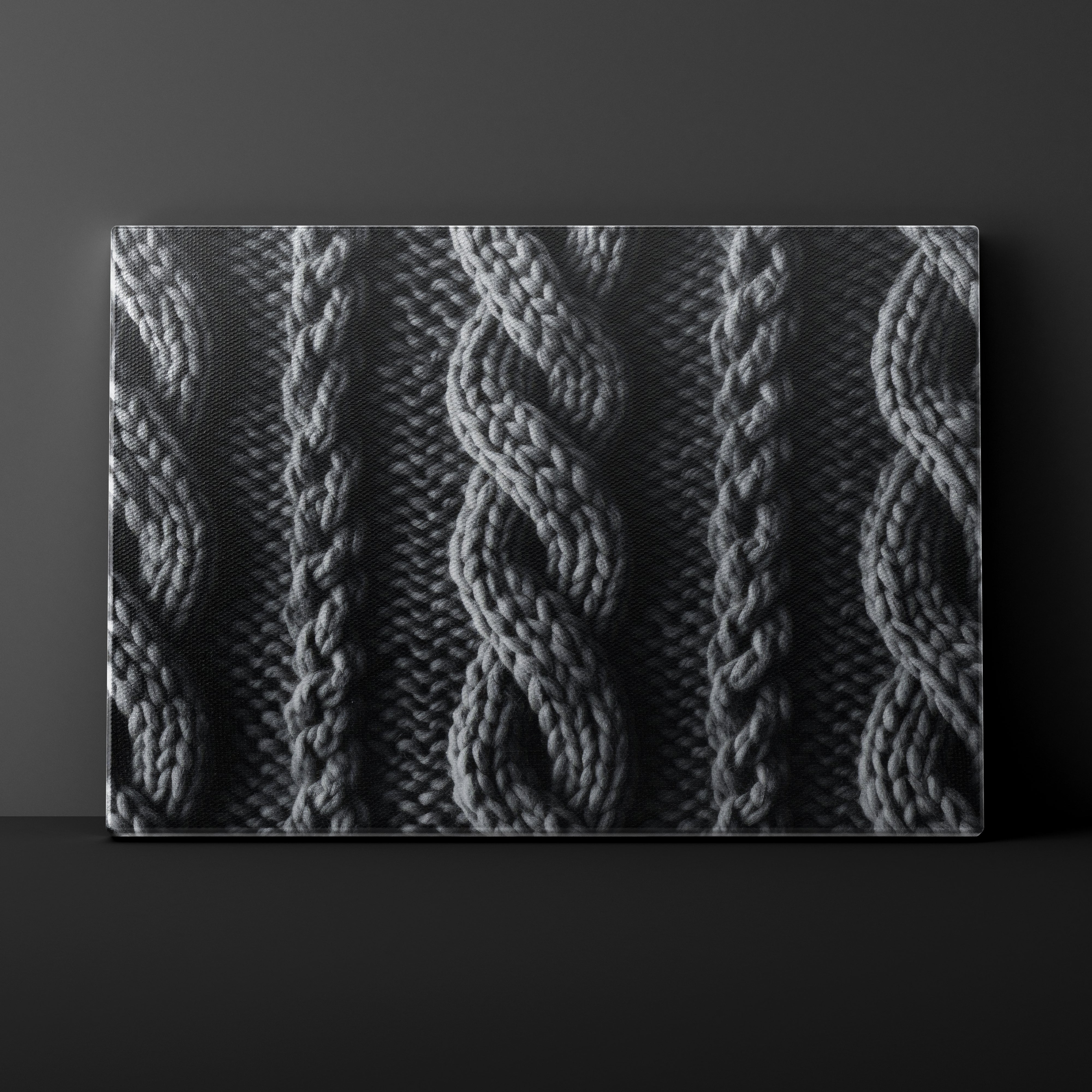 Textured fabric with cable knit pattern on a dark background