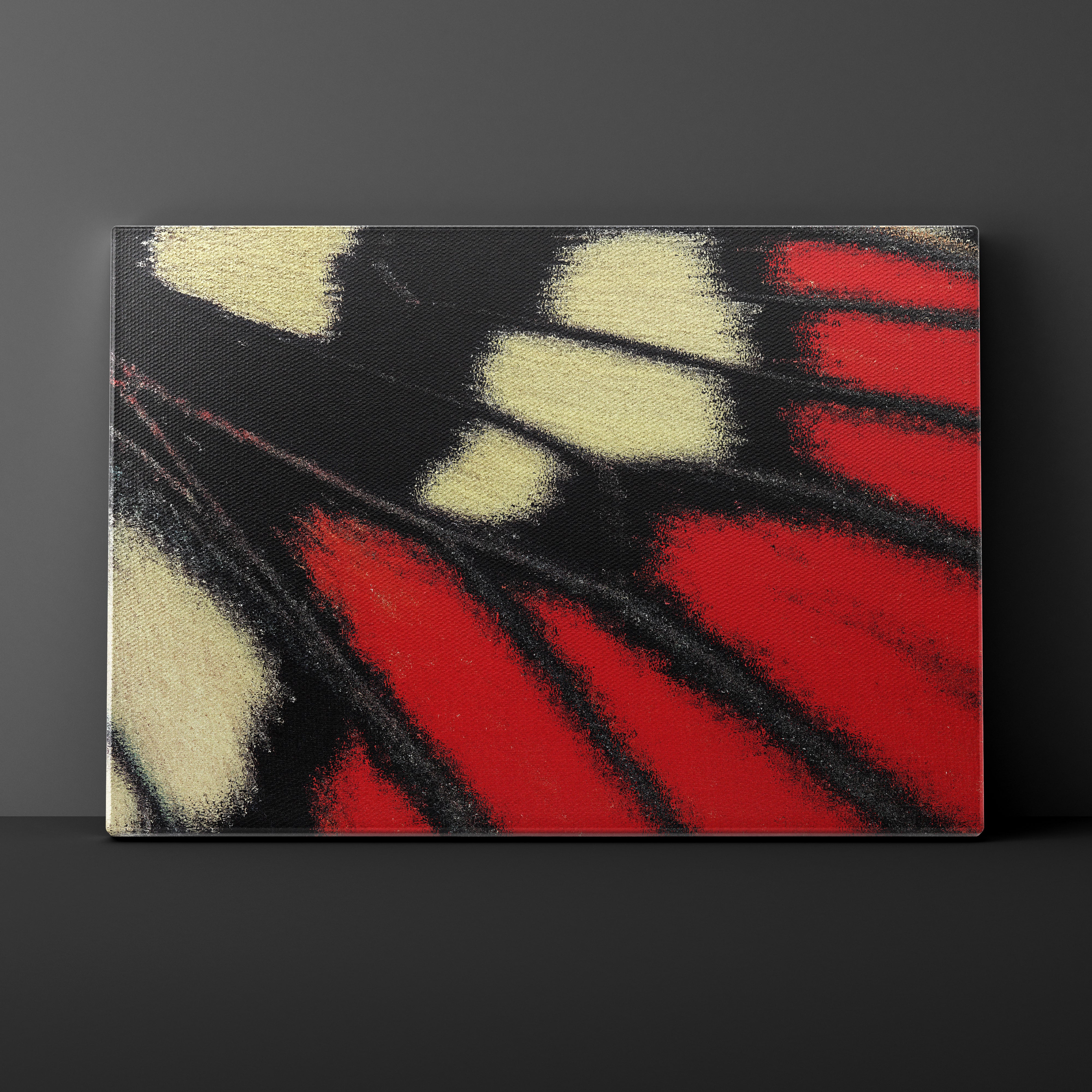 Abstract art piece with red, black, and white colors on a dark background