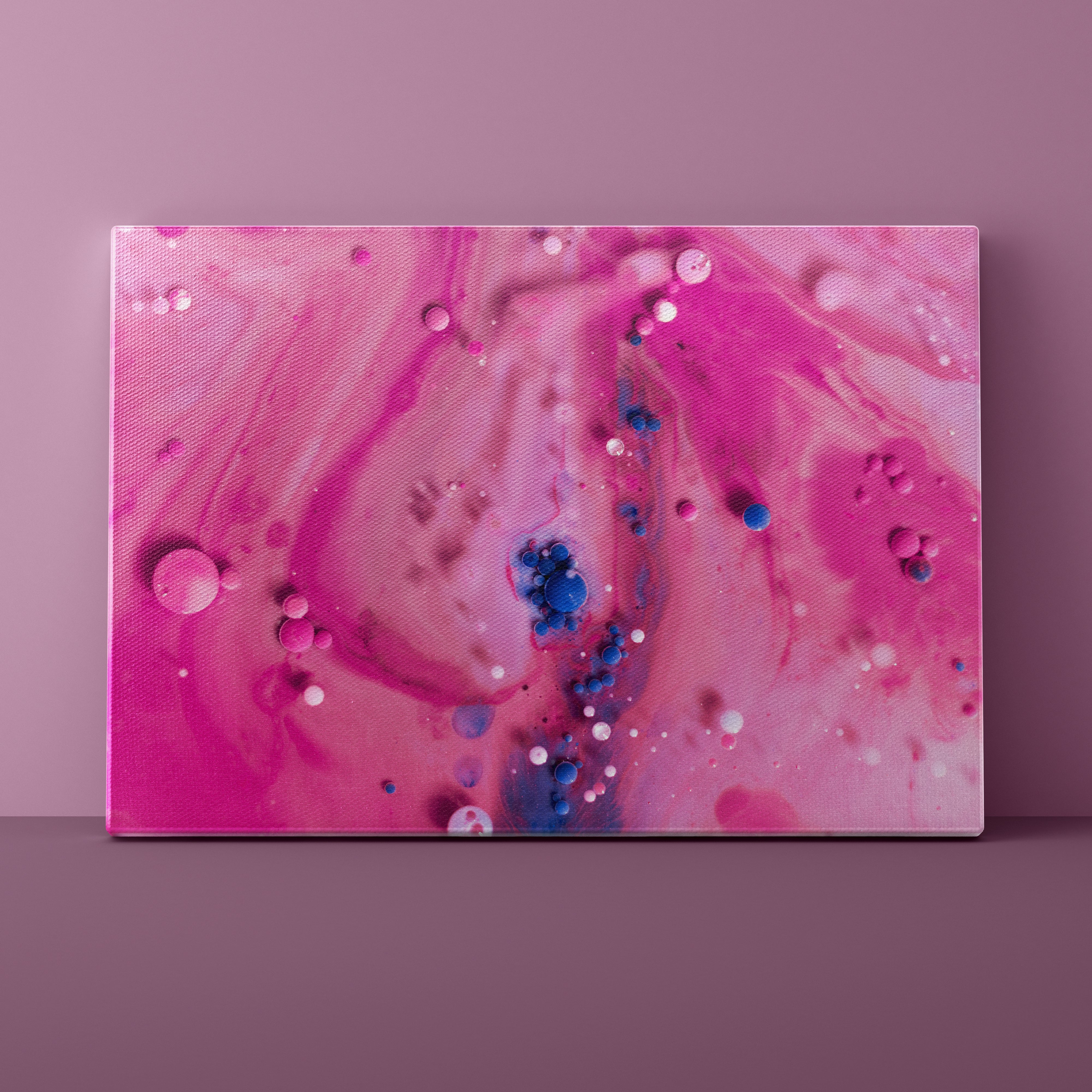 Abstract art piece with pink and blue colors on a purple background