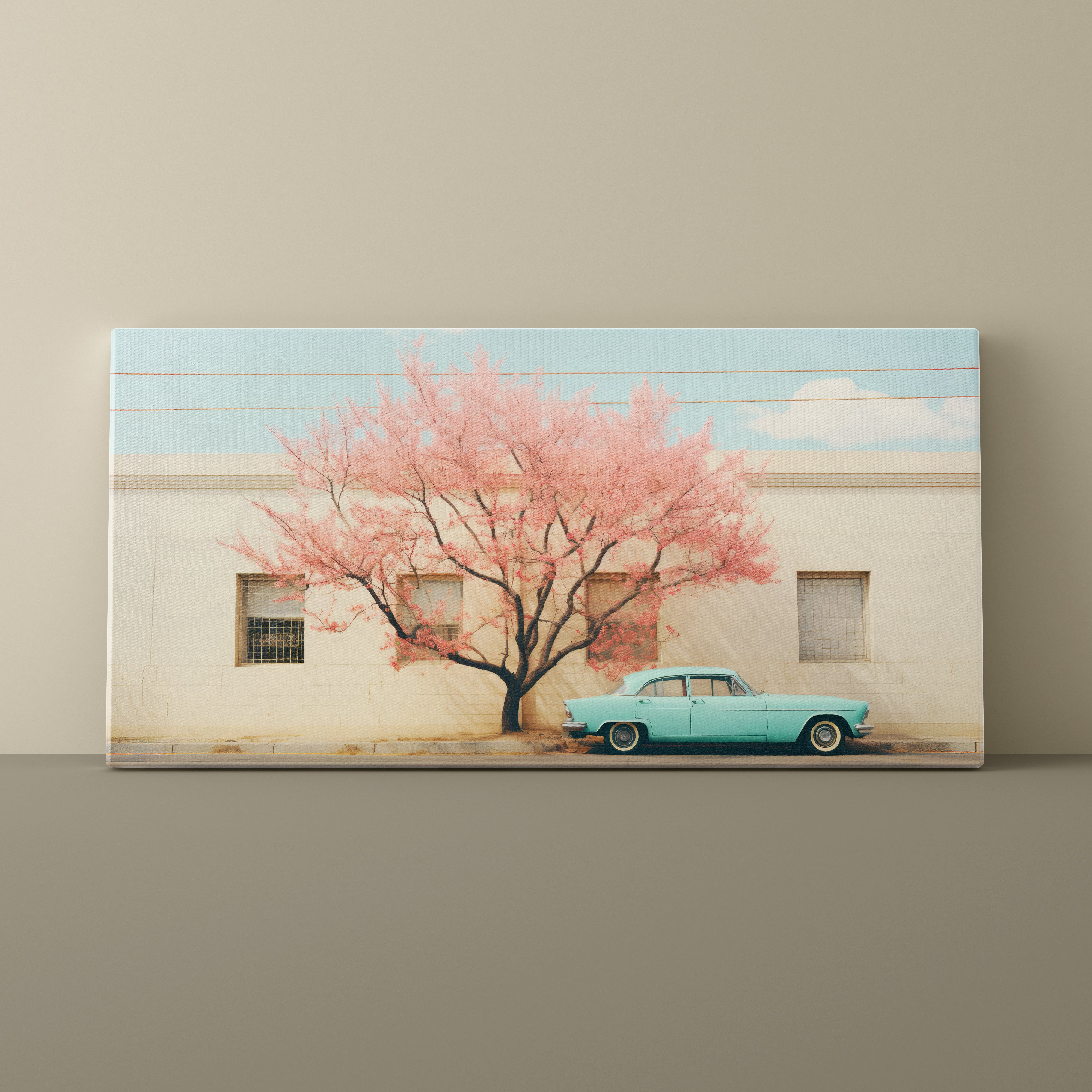 Canvas print of a cherry blossom tree and vintage car against a beige wall.