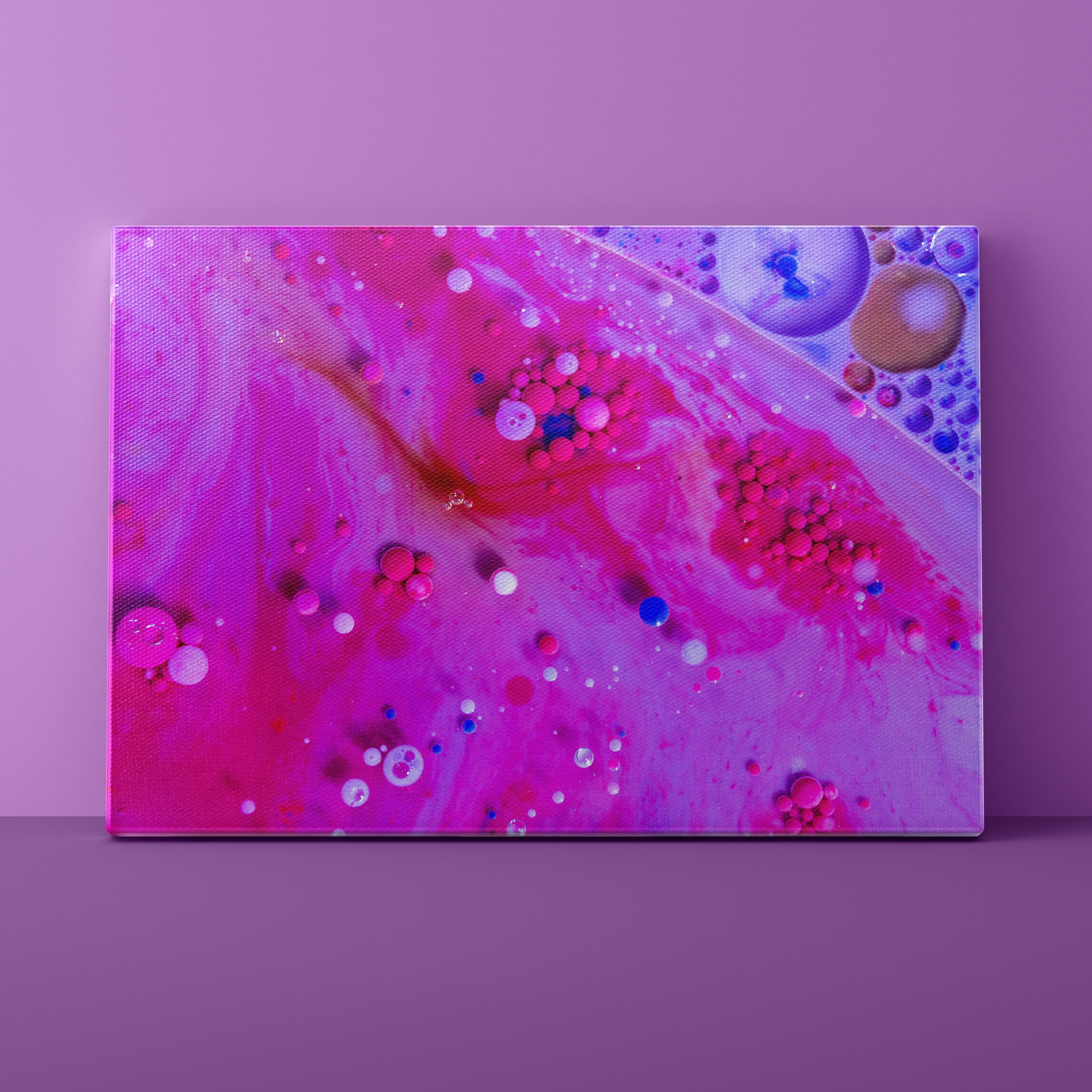 Abstract art piece with pink and purple colors on a purple background
