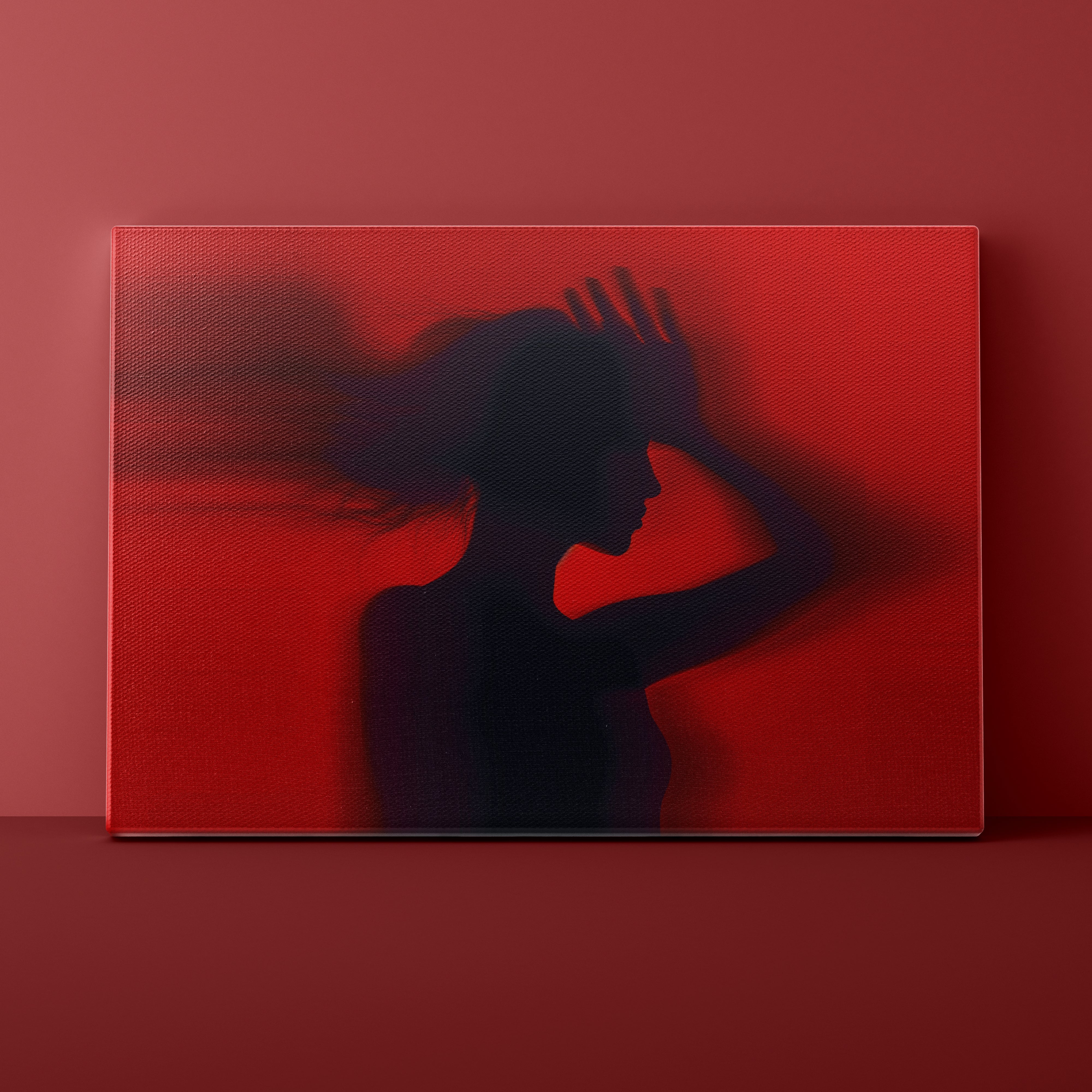Silhouette of a person against a red background