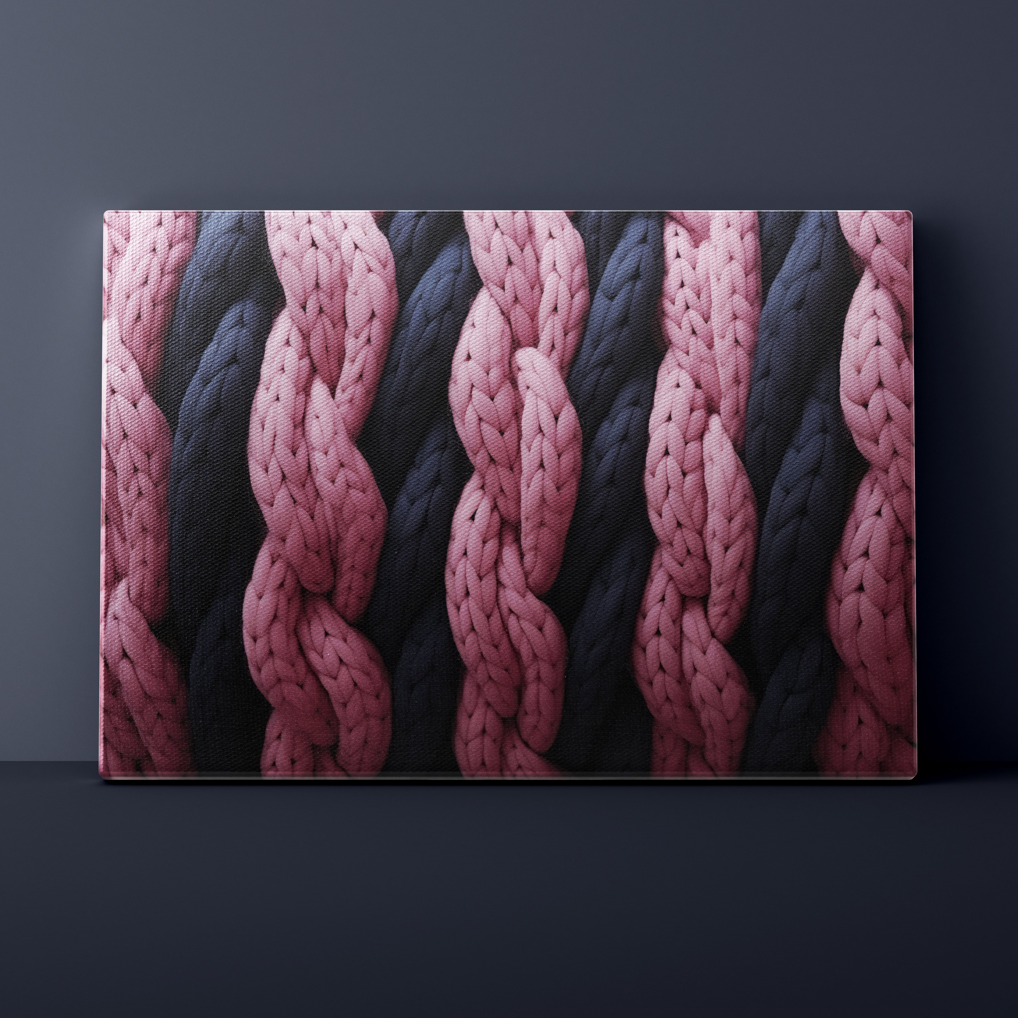 Canvas print of braided pink and black pattern on a dark background