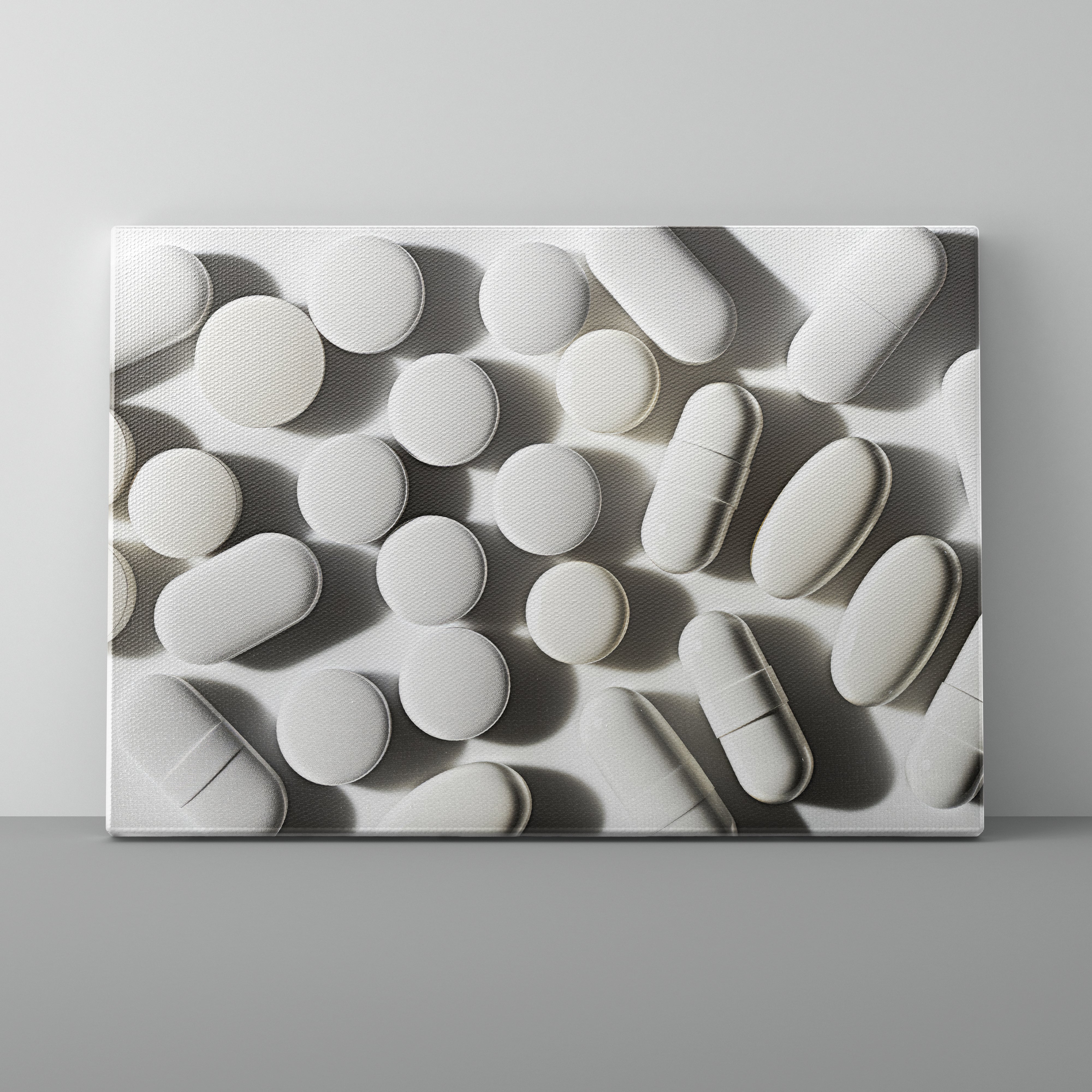 Pattern of white pills on a gray background