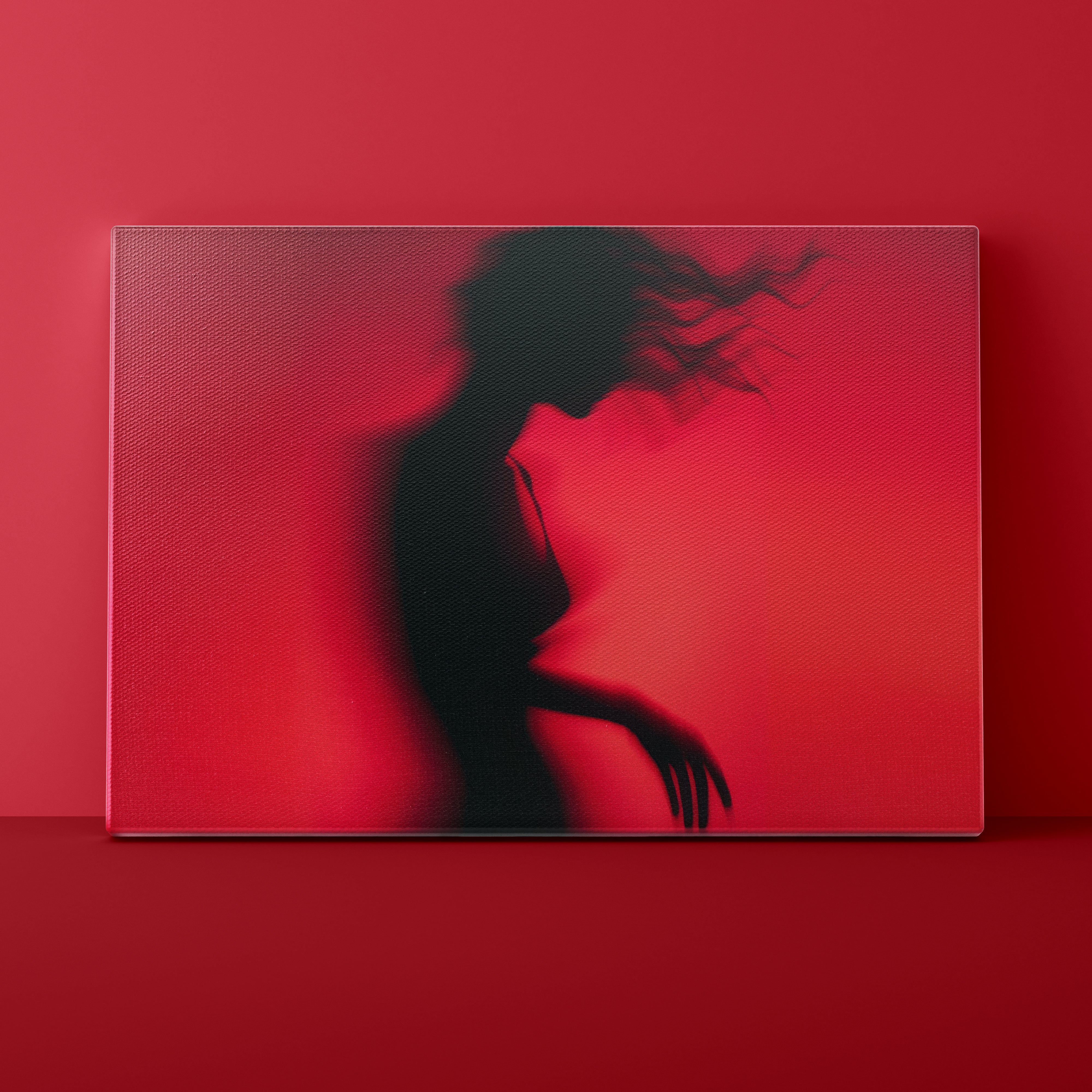 Silhouette of a person against a red background