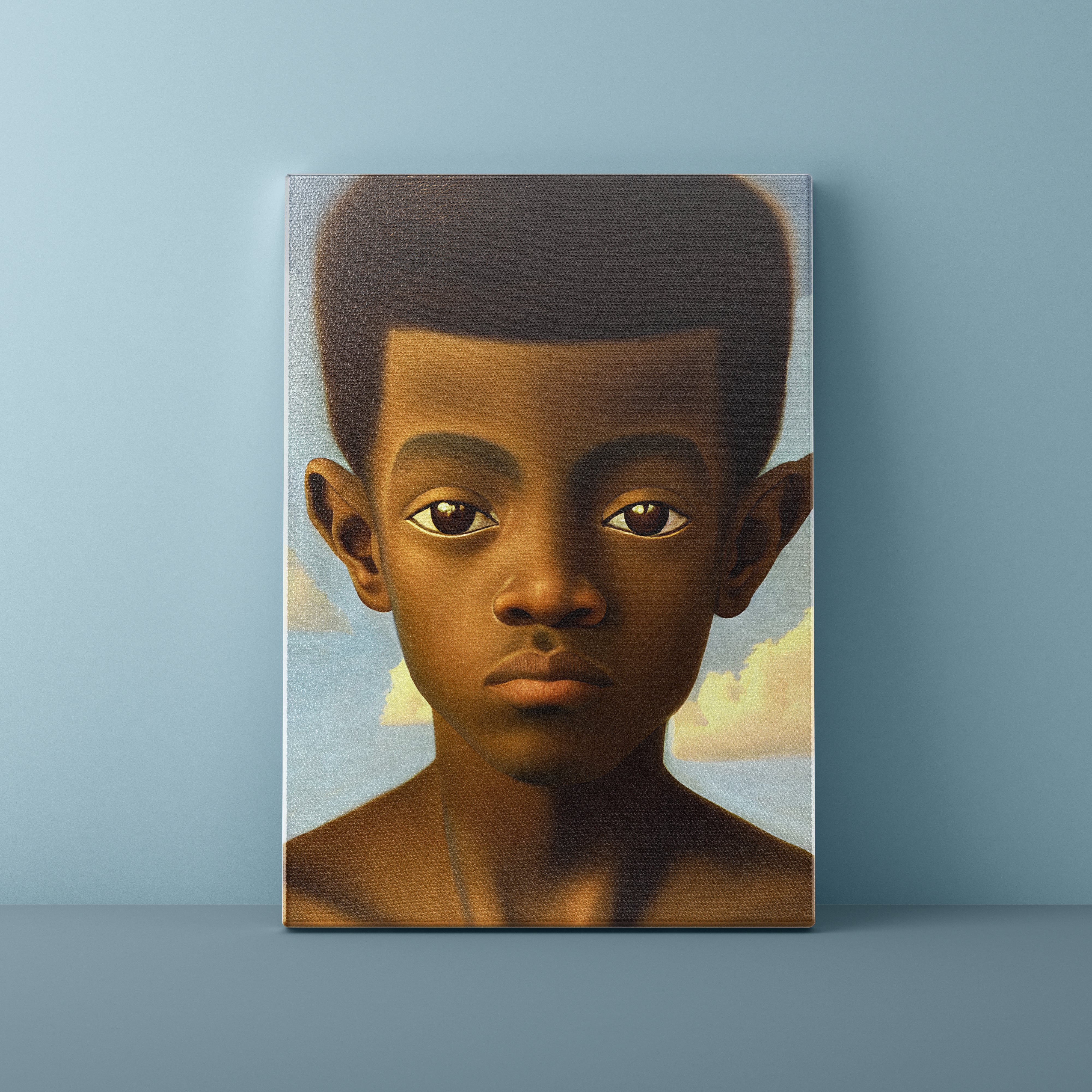 Canvas print of a young boy's portrait against a blue wall.
