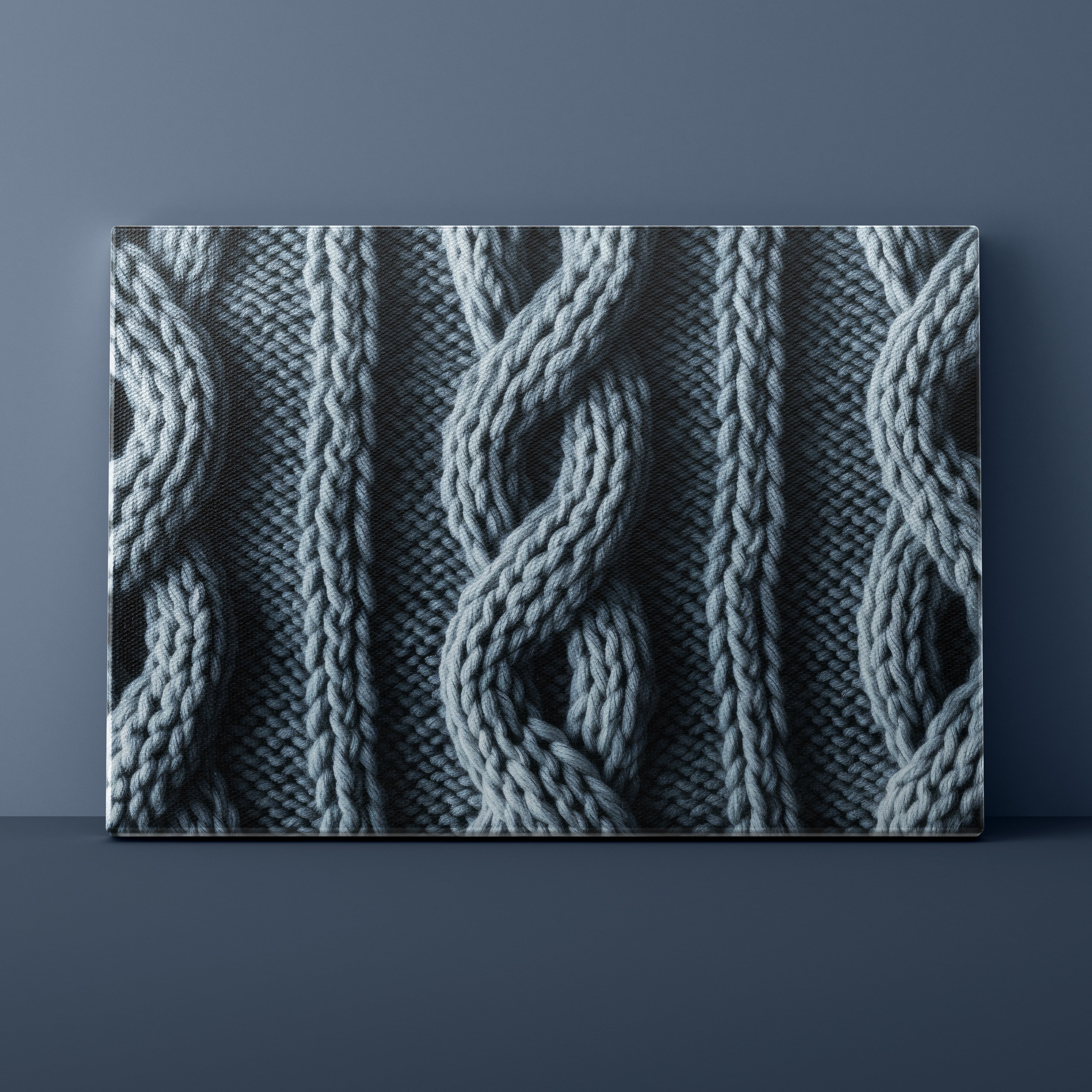 Textured fabric with cable knit pattern against a dark blue background