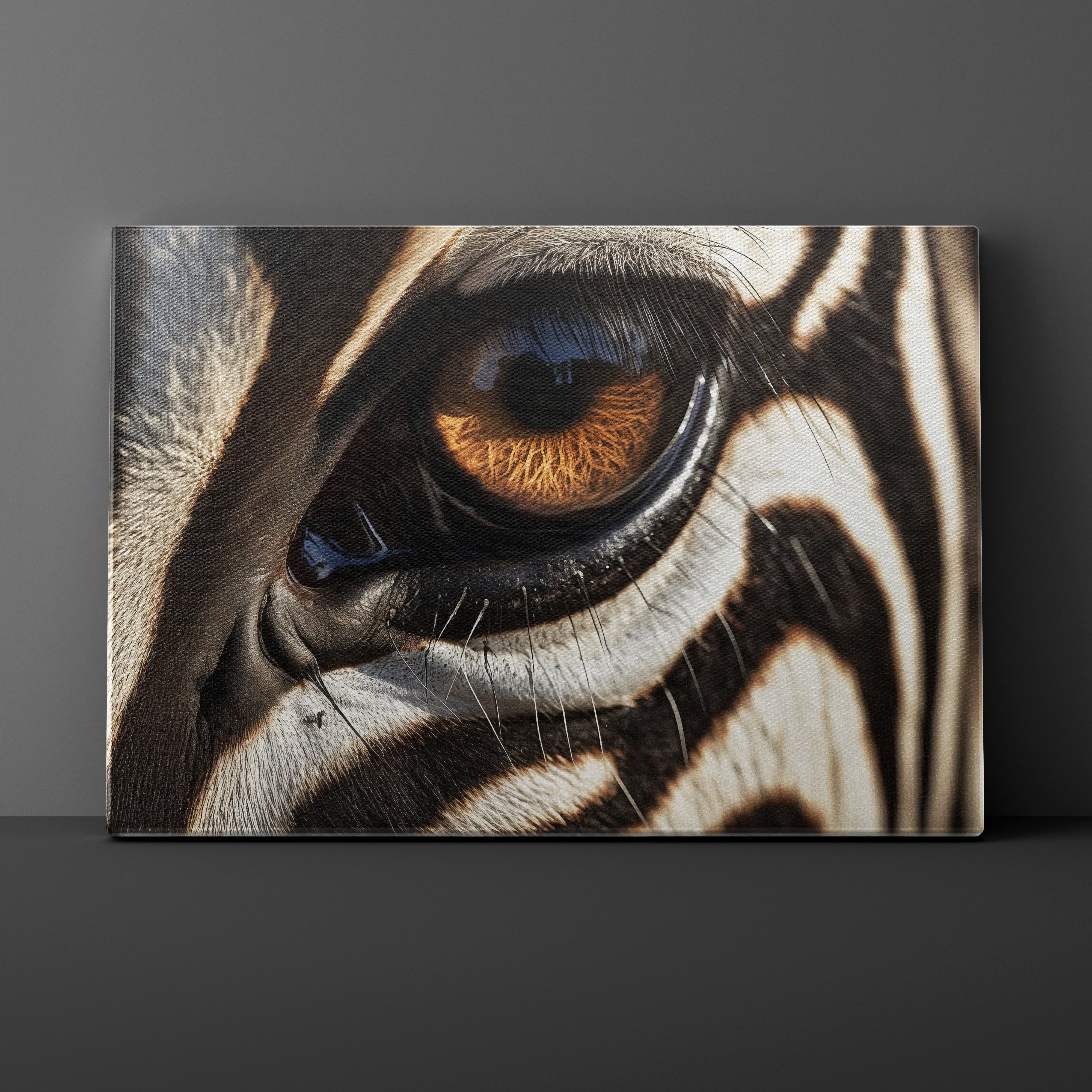 Close-up of a zebra's eye with detailed stripes on a dark background