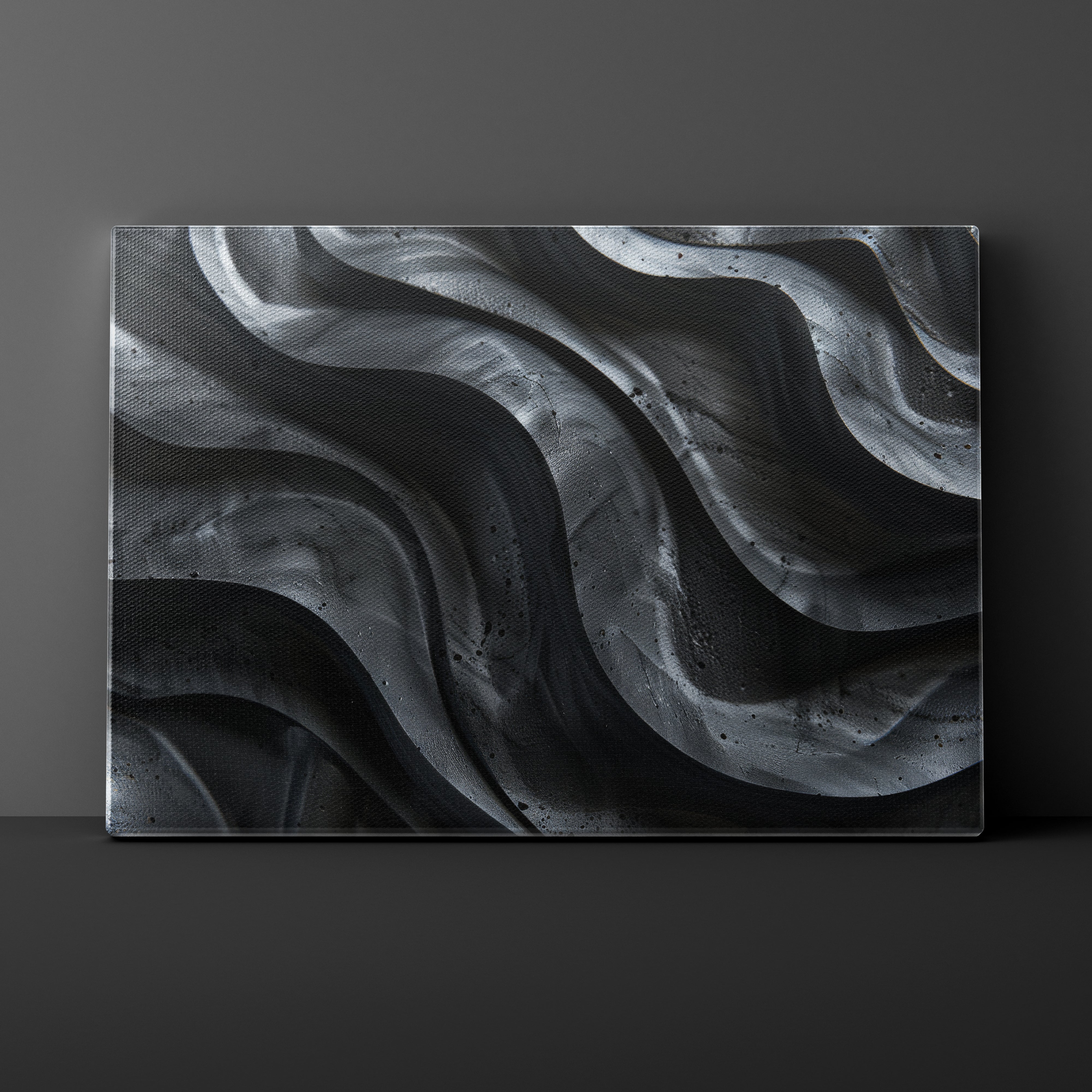 Abstract black and gray wavy pattern on a dark background