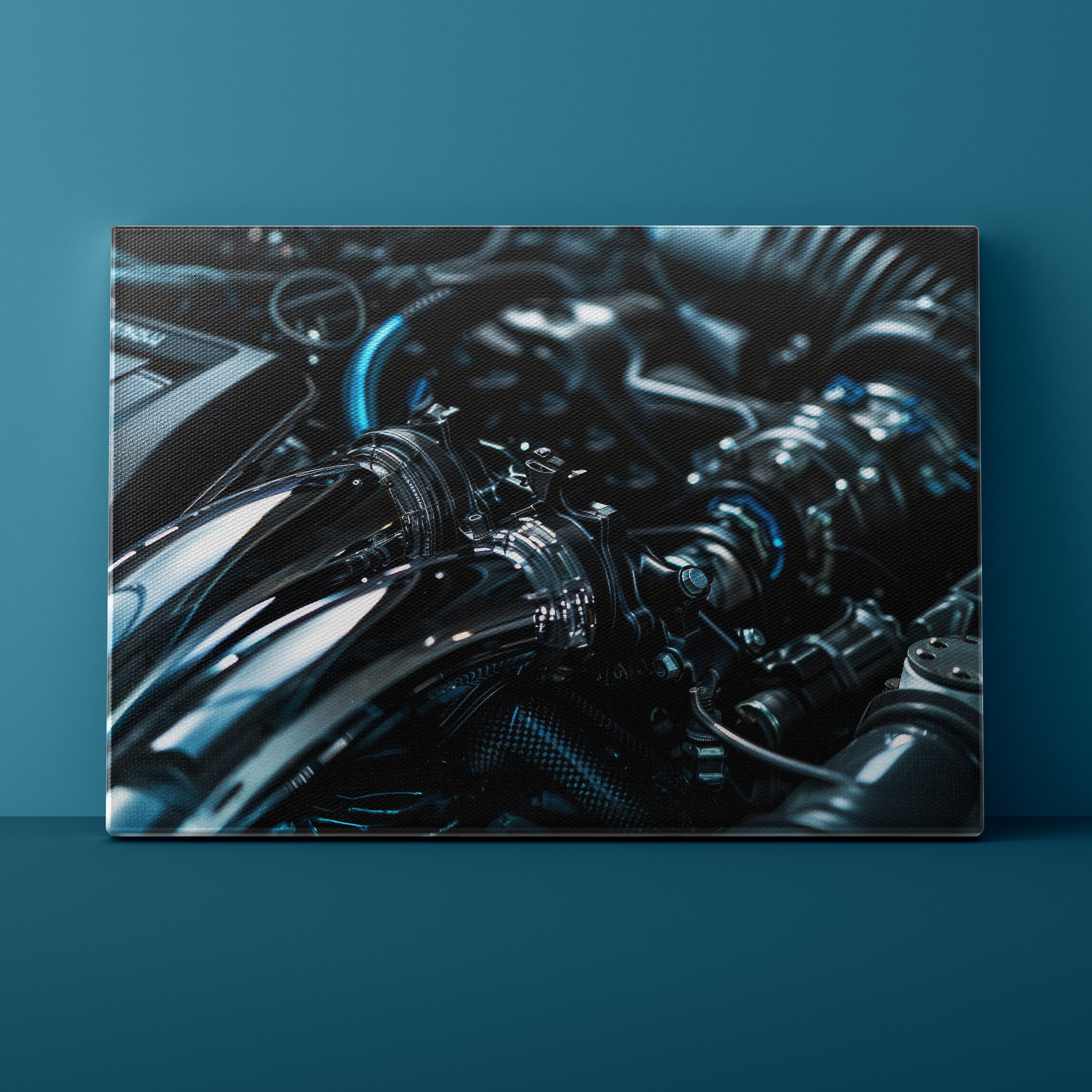 Close-up of a motorcycle engine on a teal background