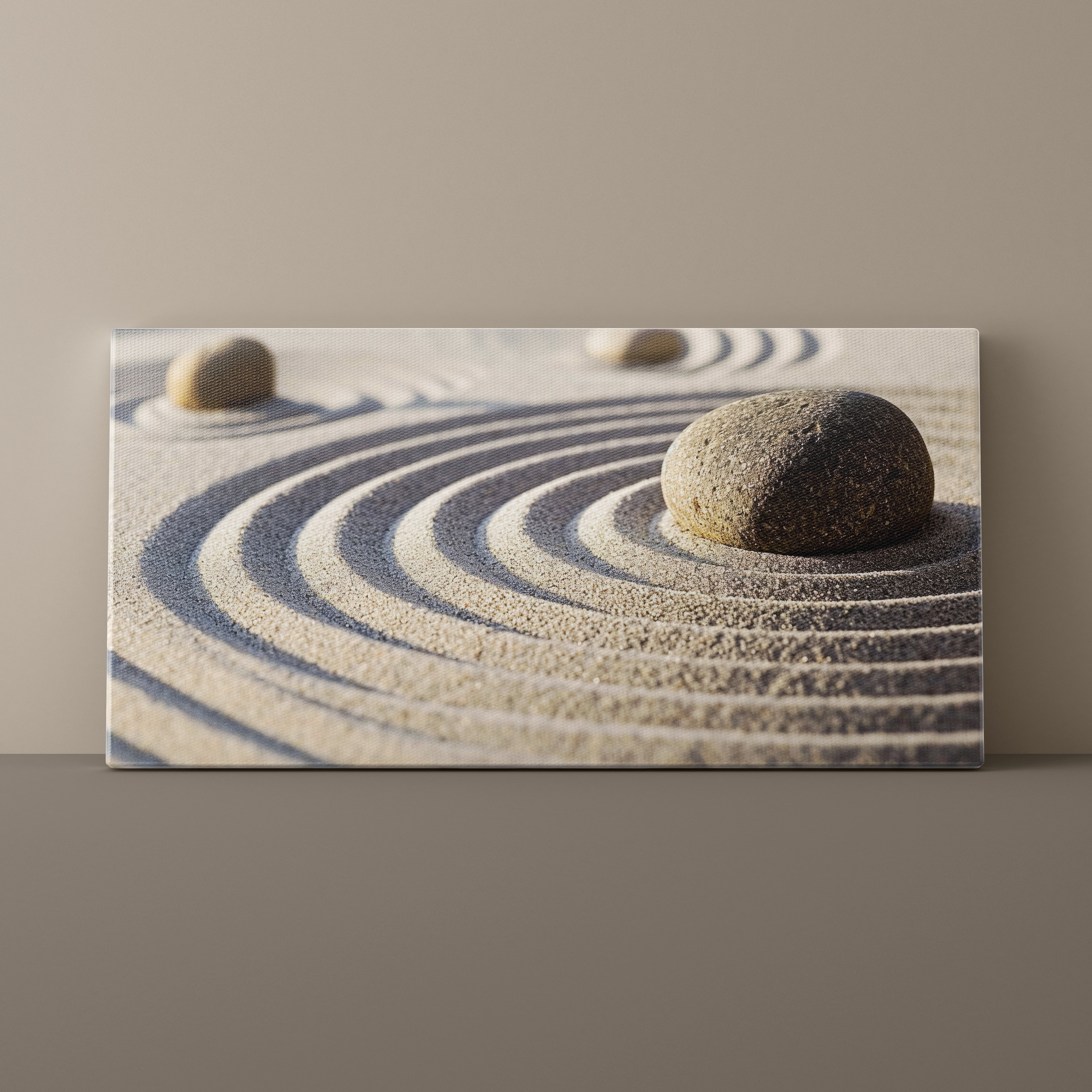 Canvas print of a zen garden with stones and sand on a plain background