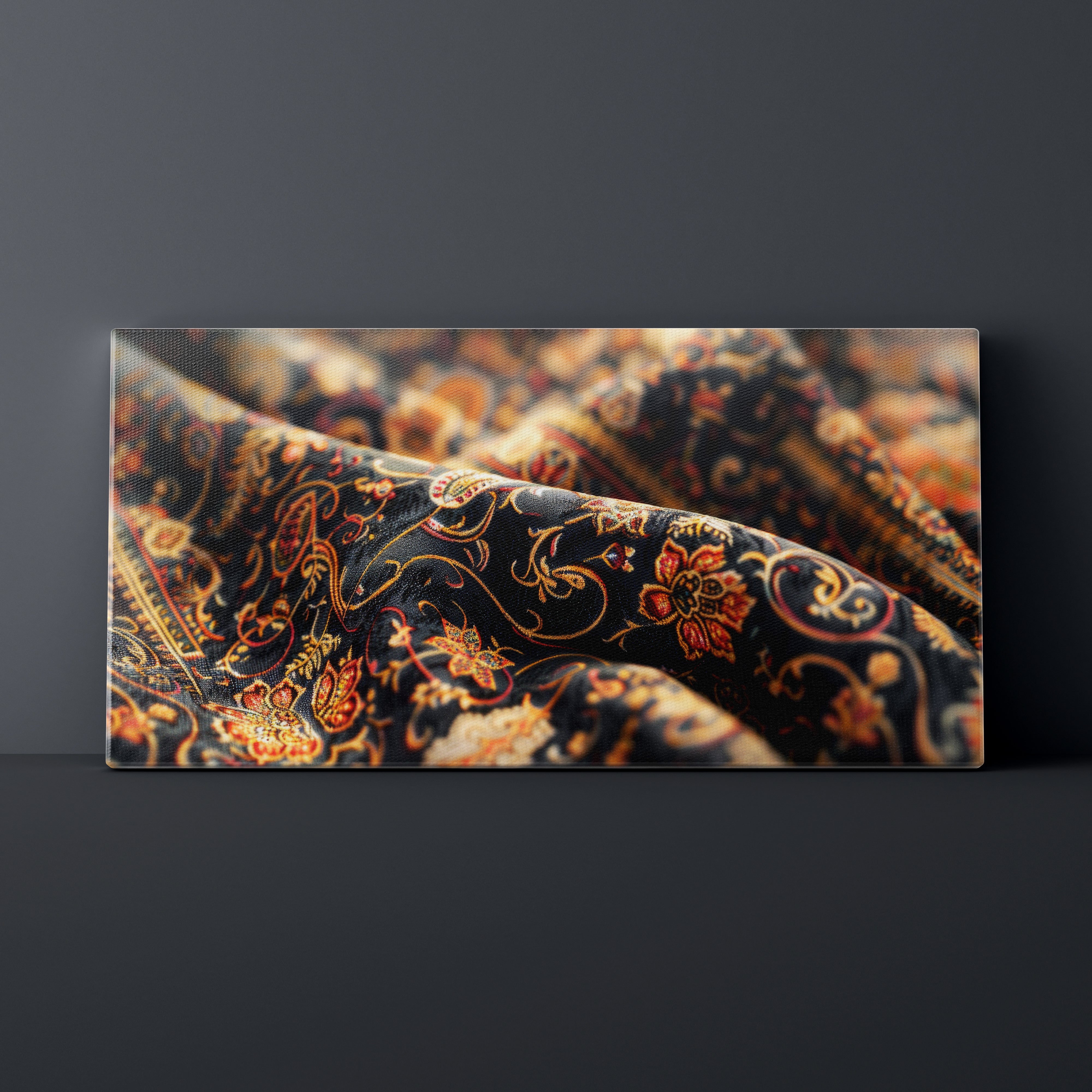 Close-up of a patterned fabric with intricate designs on a dark background