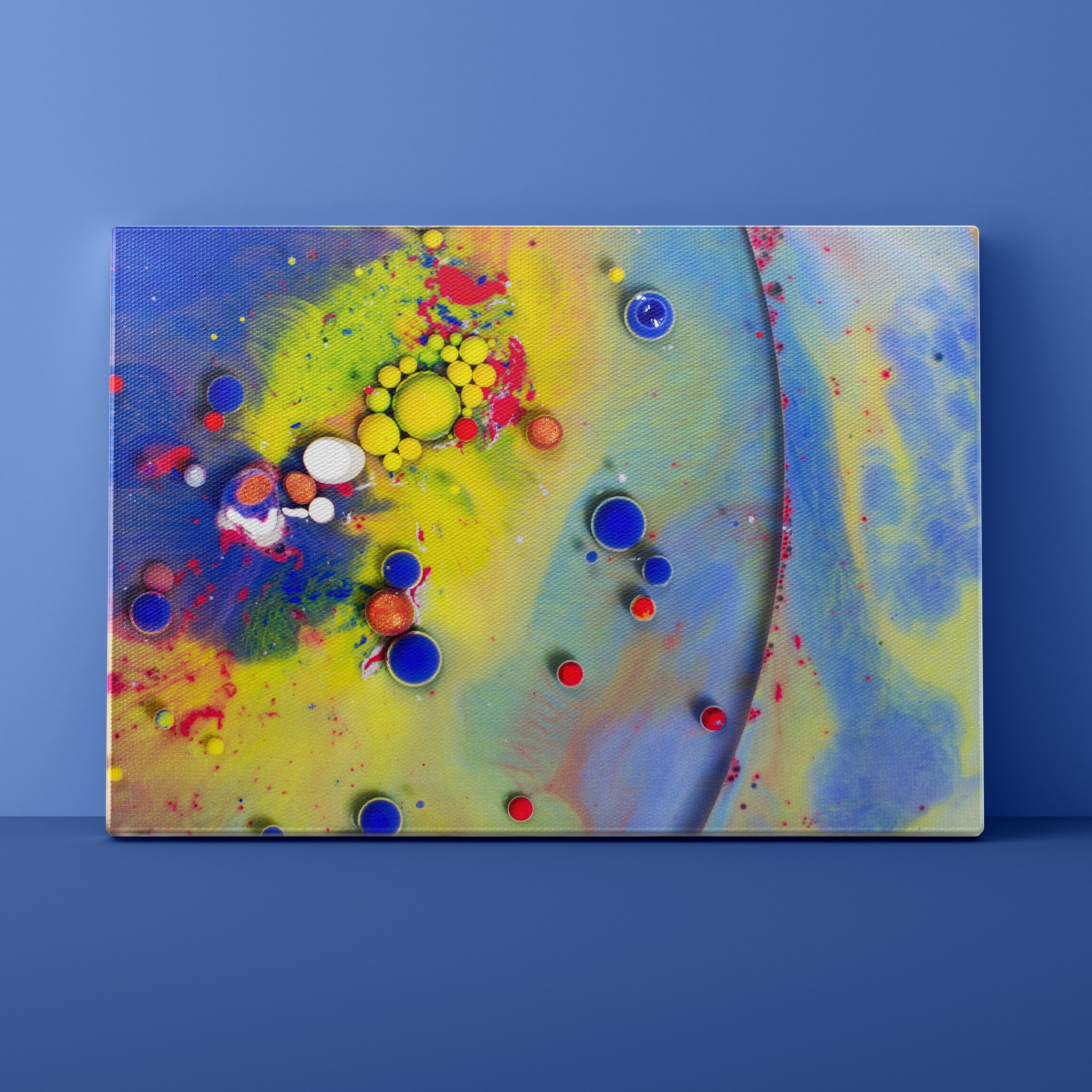 Abstract art canvas with colorful circles on a blue background
