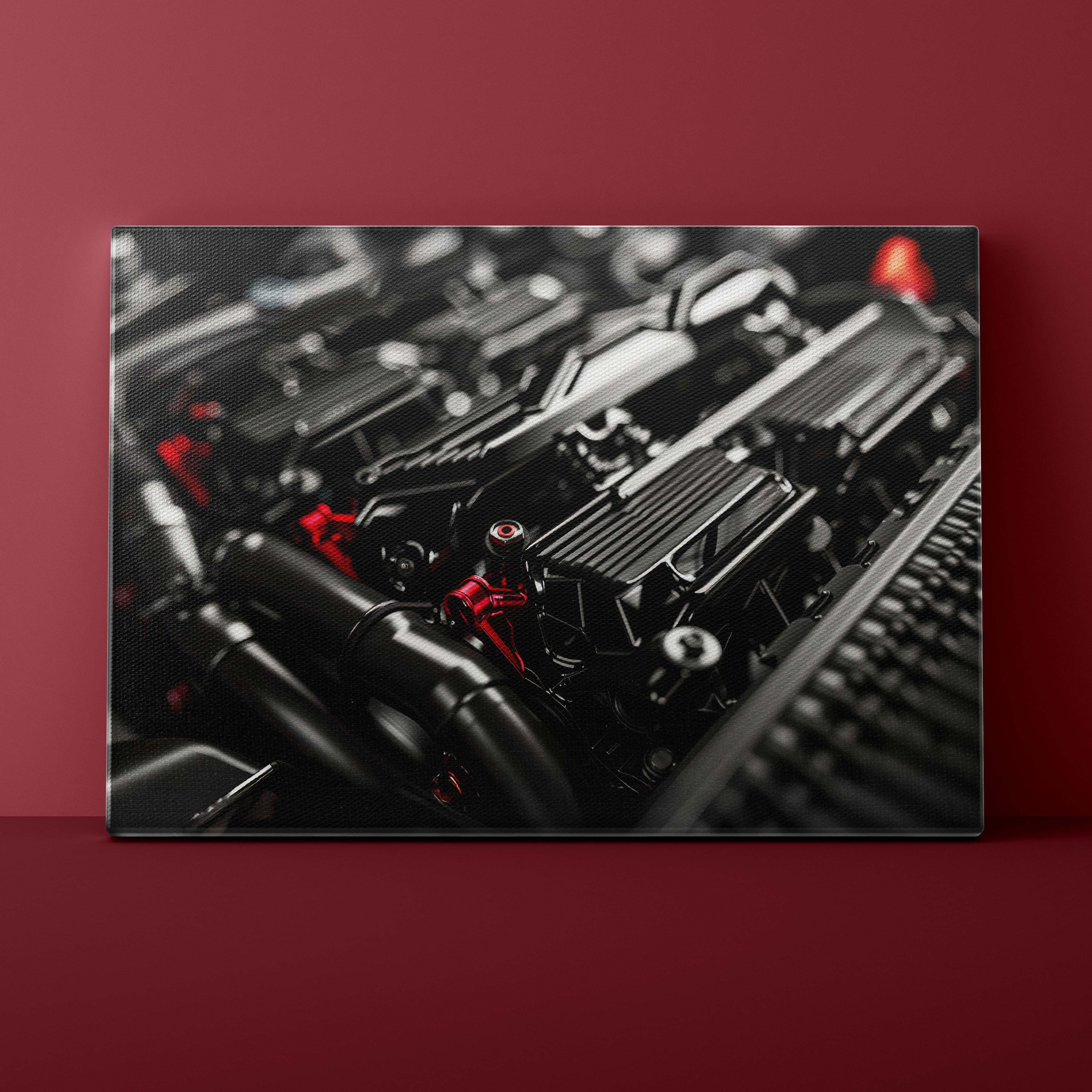 Close-up of a car engine on a red background