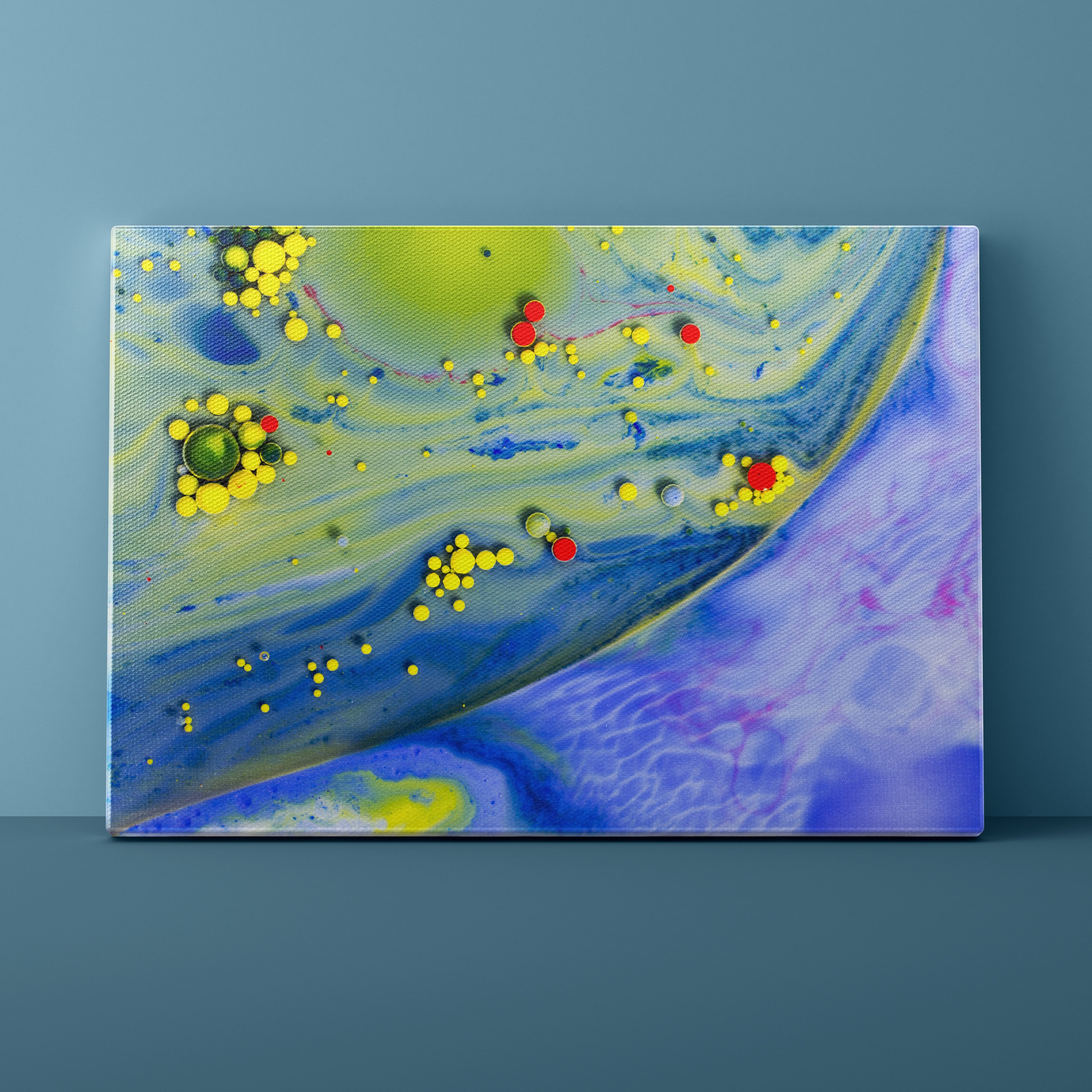 Abstract painting with colorful dots on a blue background