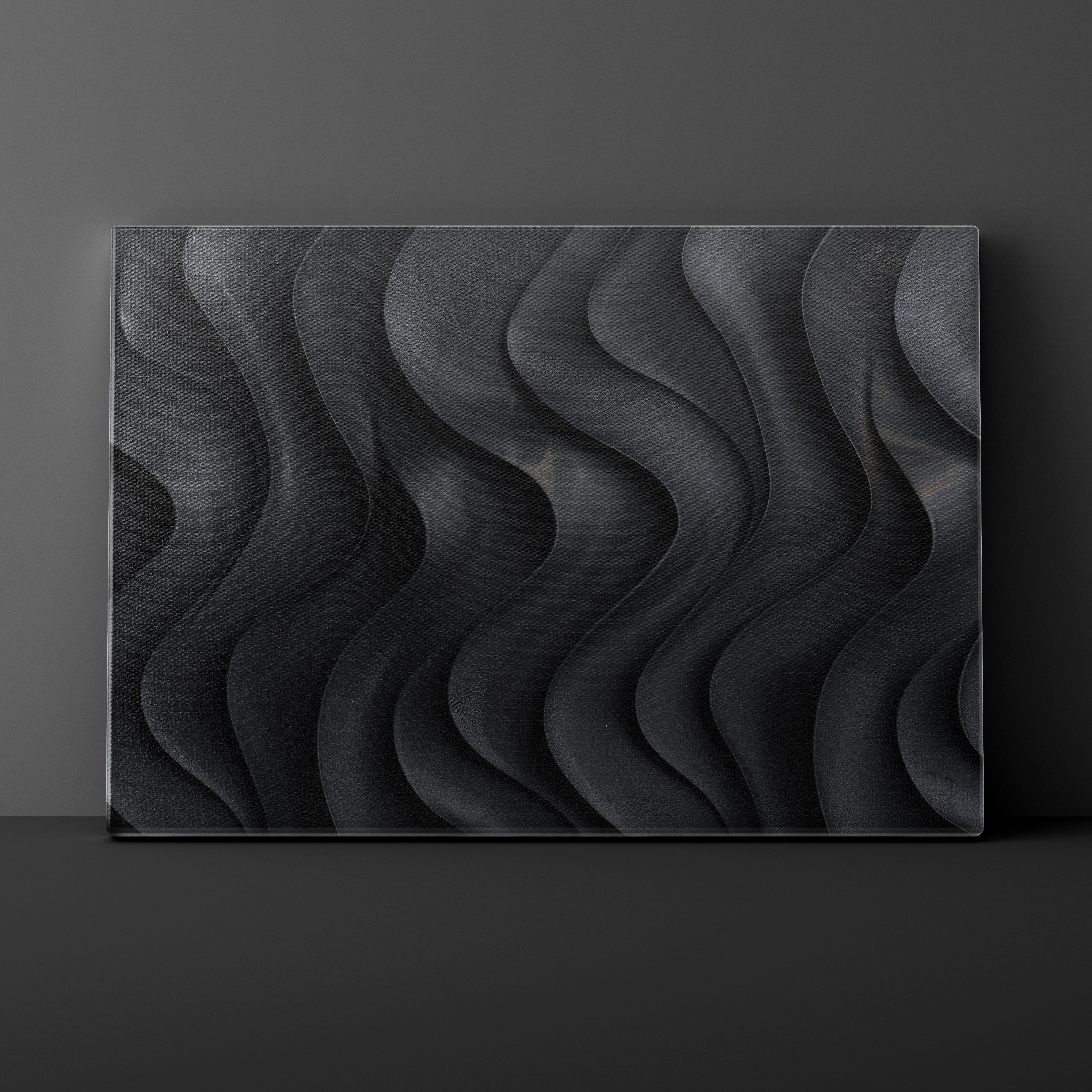 Black textured wall art panel on a dark gray background