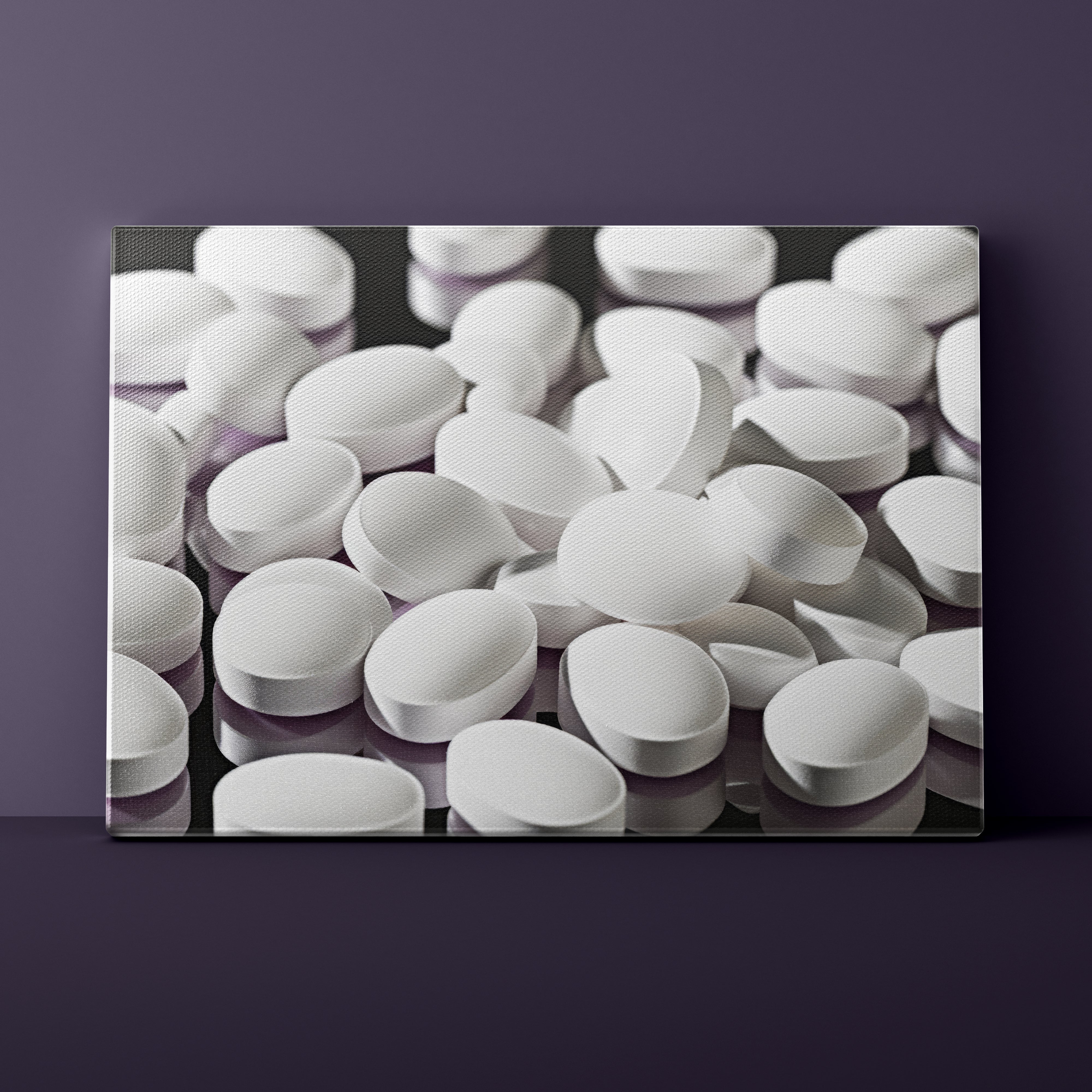 Canvas print of white pills on a dark background
