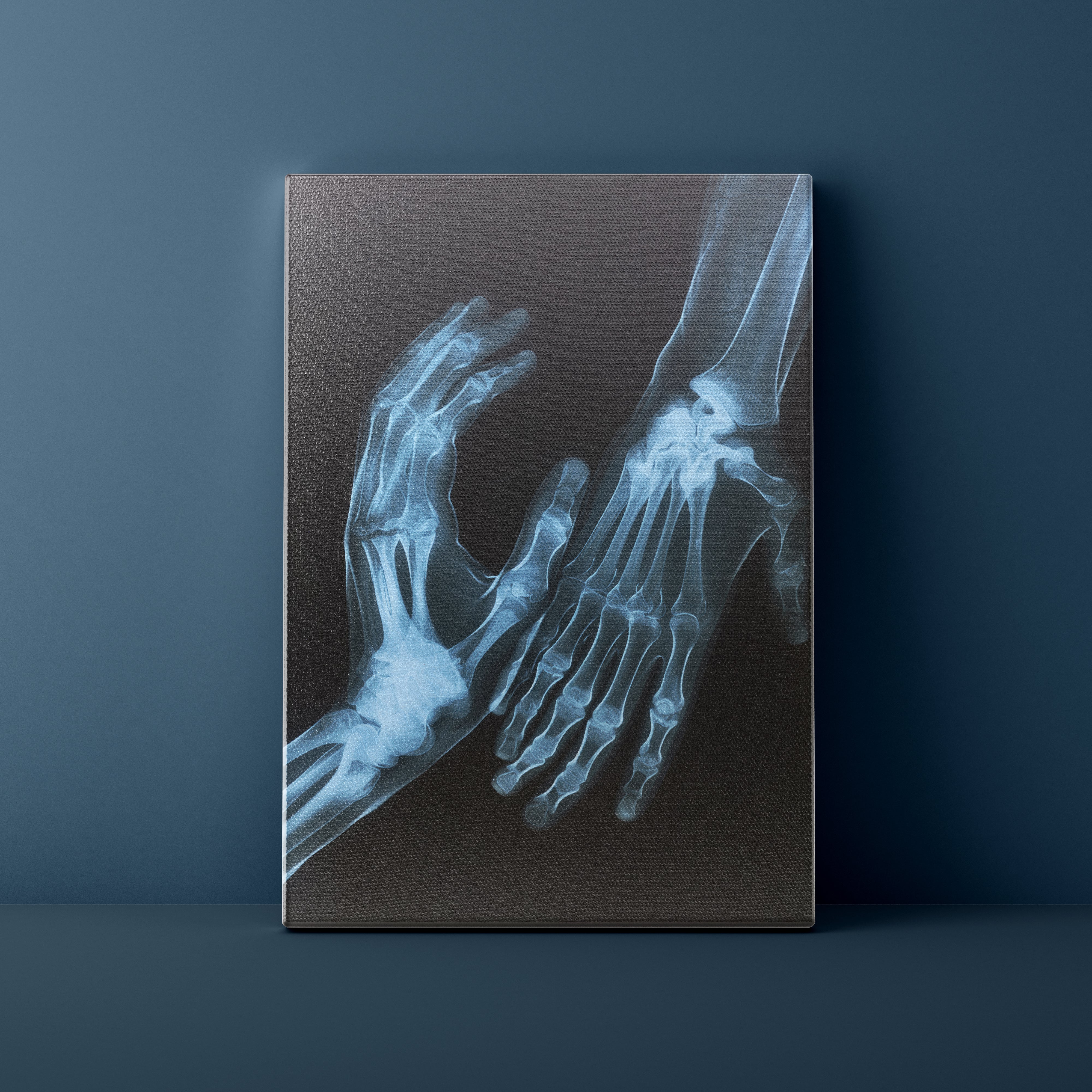 X-ray image of a hand and foot on a dark background