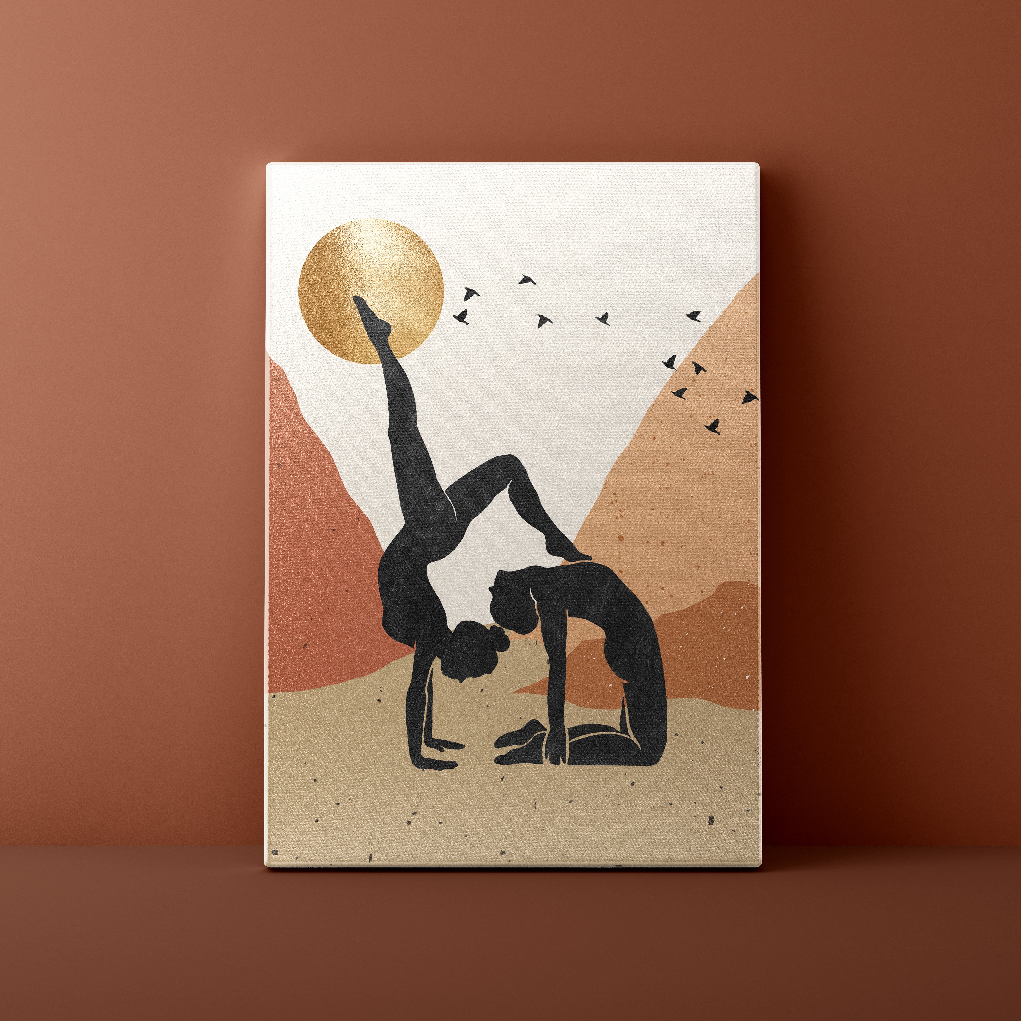 Canvas print with a silhouette of two people in a yoga pose against a mountain and sun background.