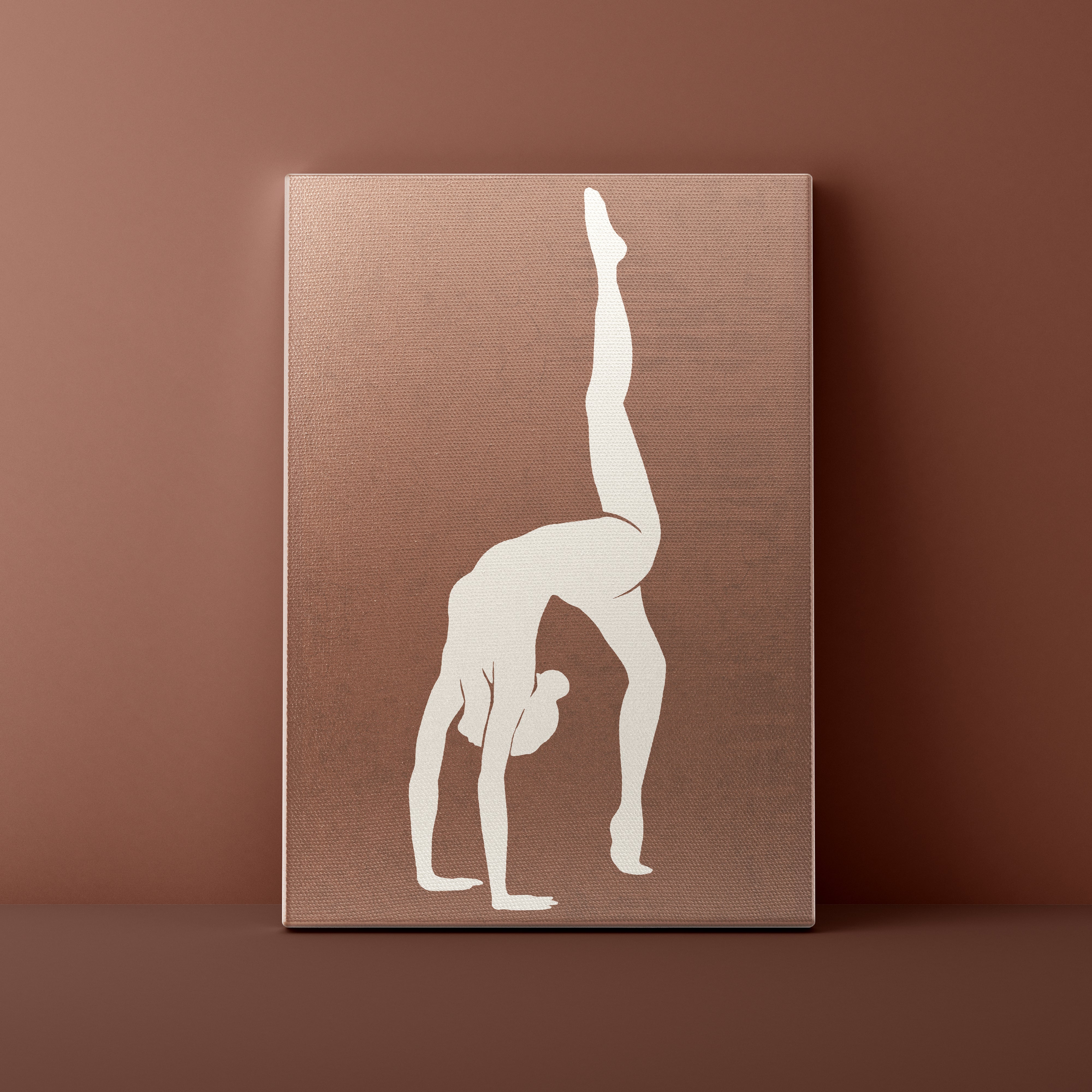 Canvas print with a white silhouette of a person in a handstand on a brown background