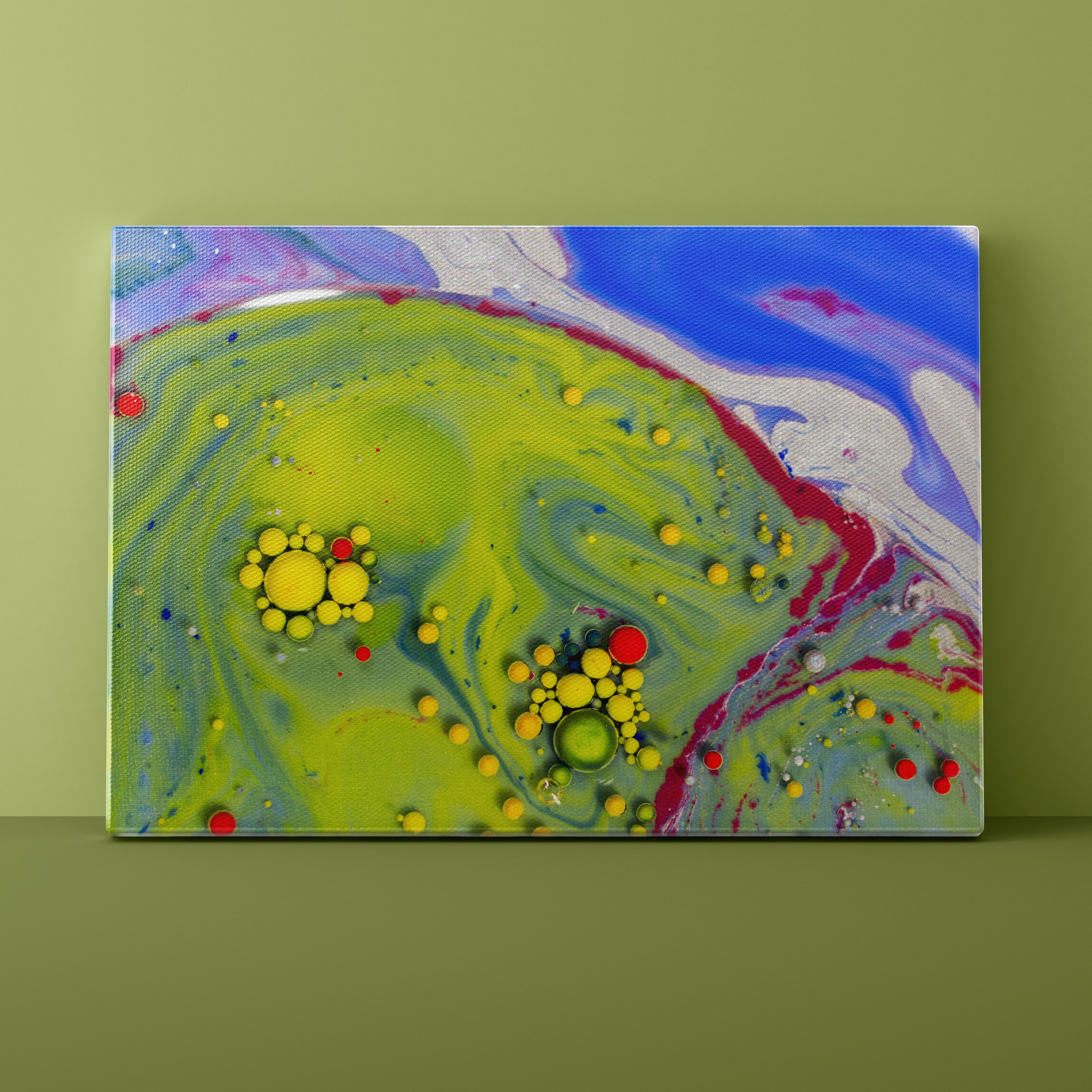 Abstract art piece with colorful circles on a green background