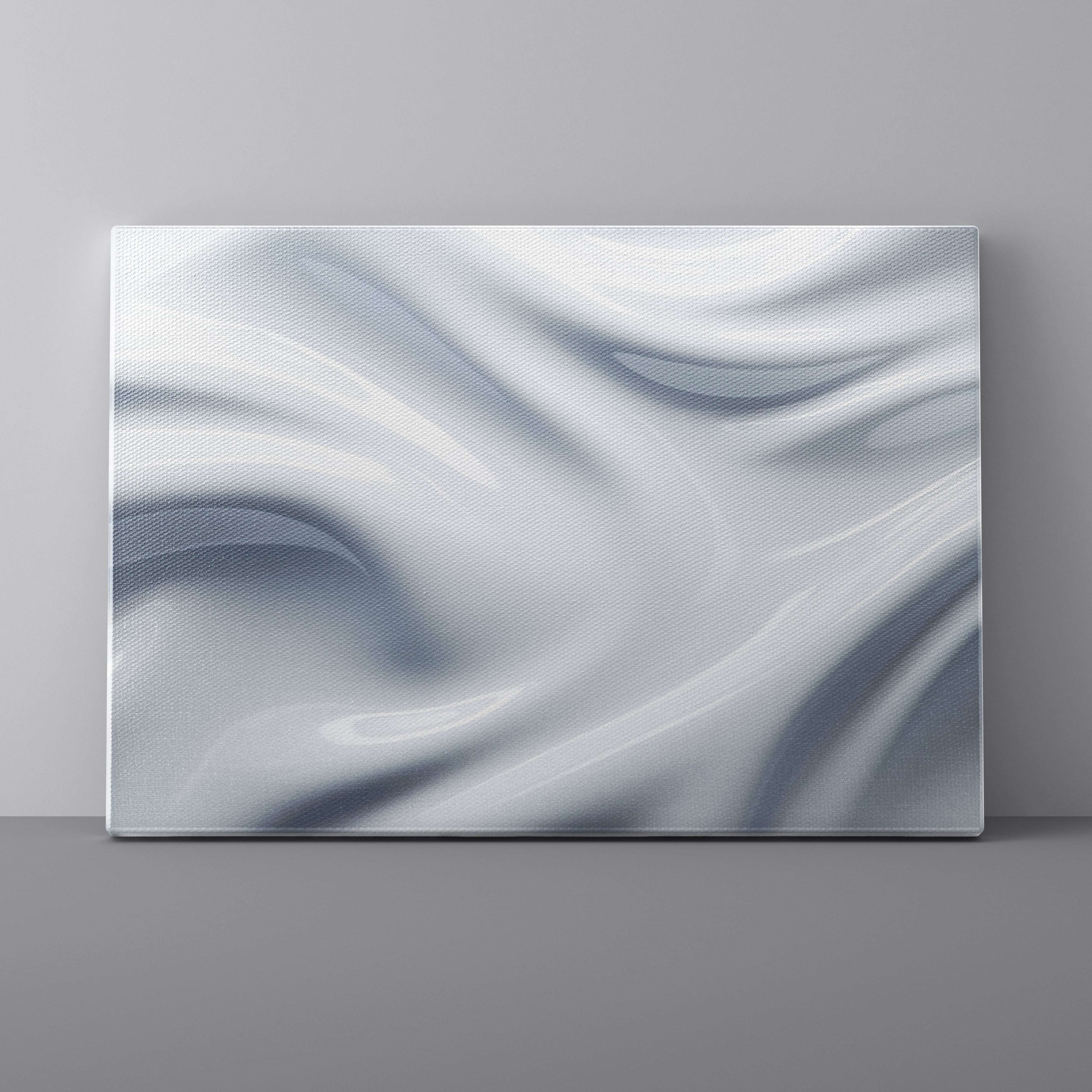 Abstract wavy design on a canvas against a gray wall