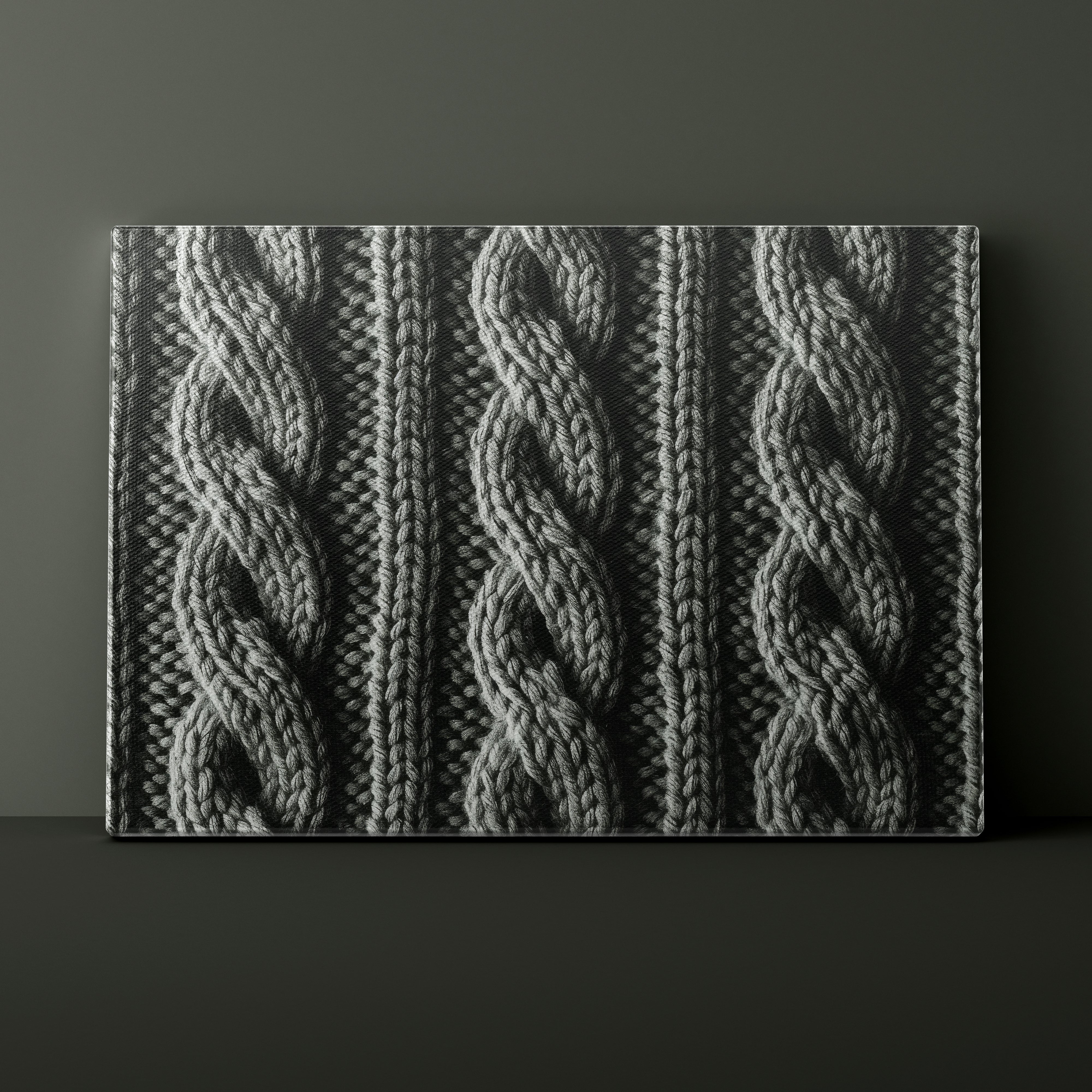Textured fabric with cable knit pattern on a dark background