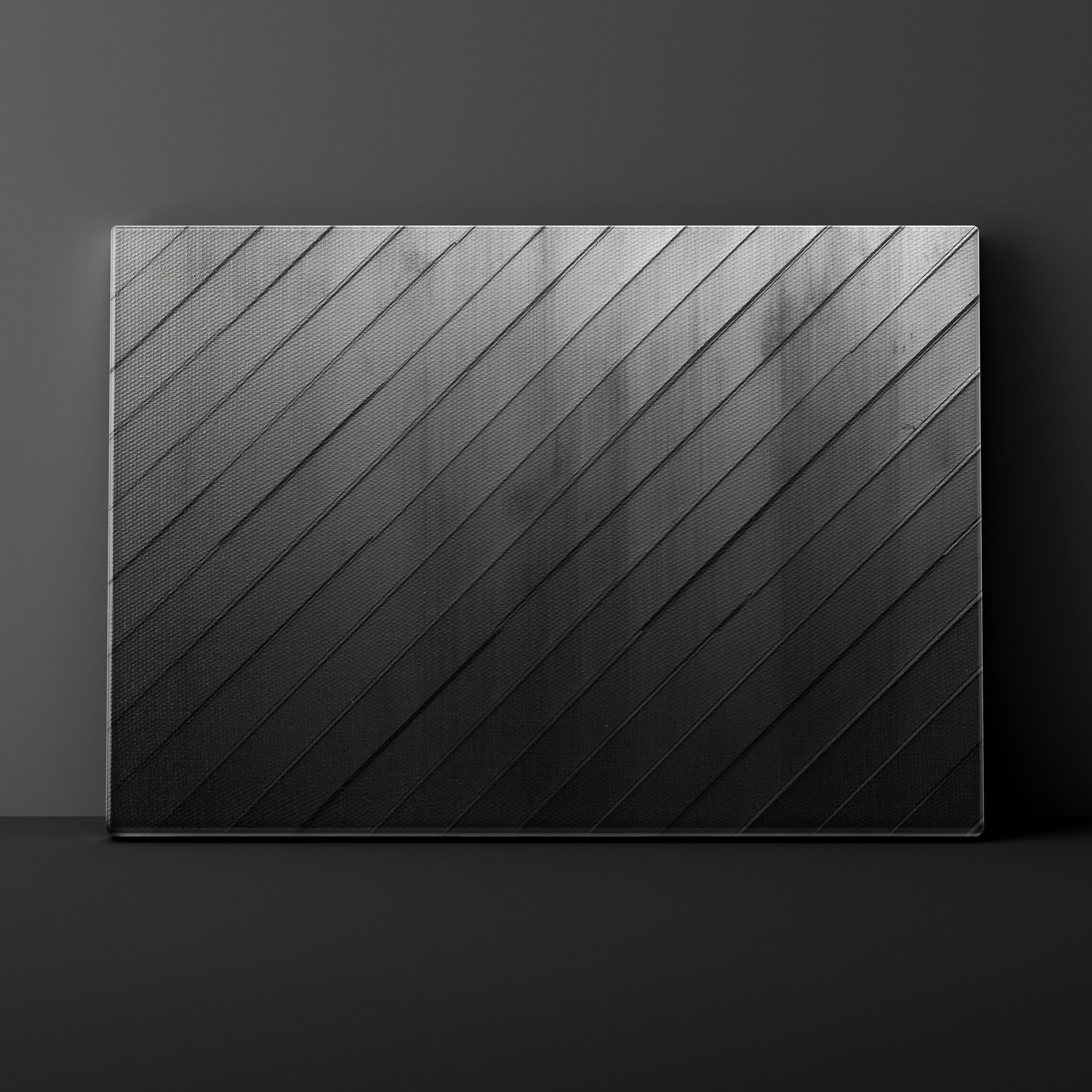 Black rectangular panel with diagonal texture pattern on a dark background