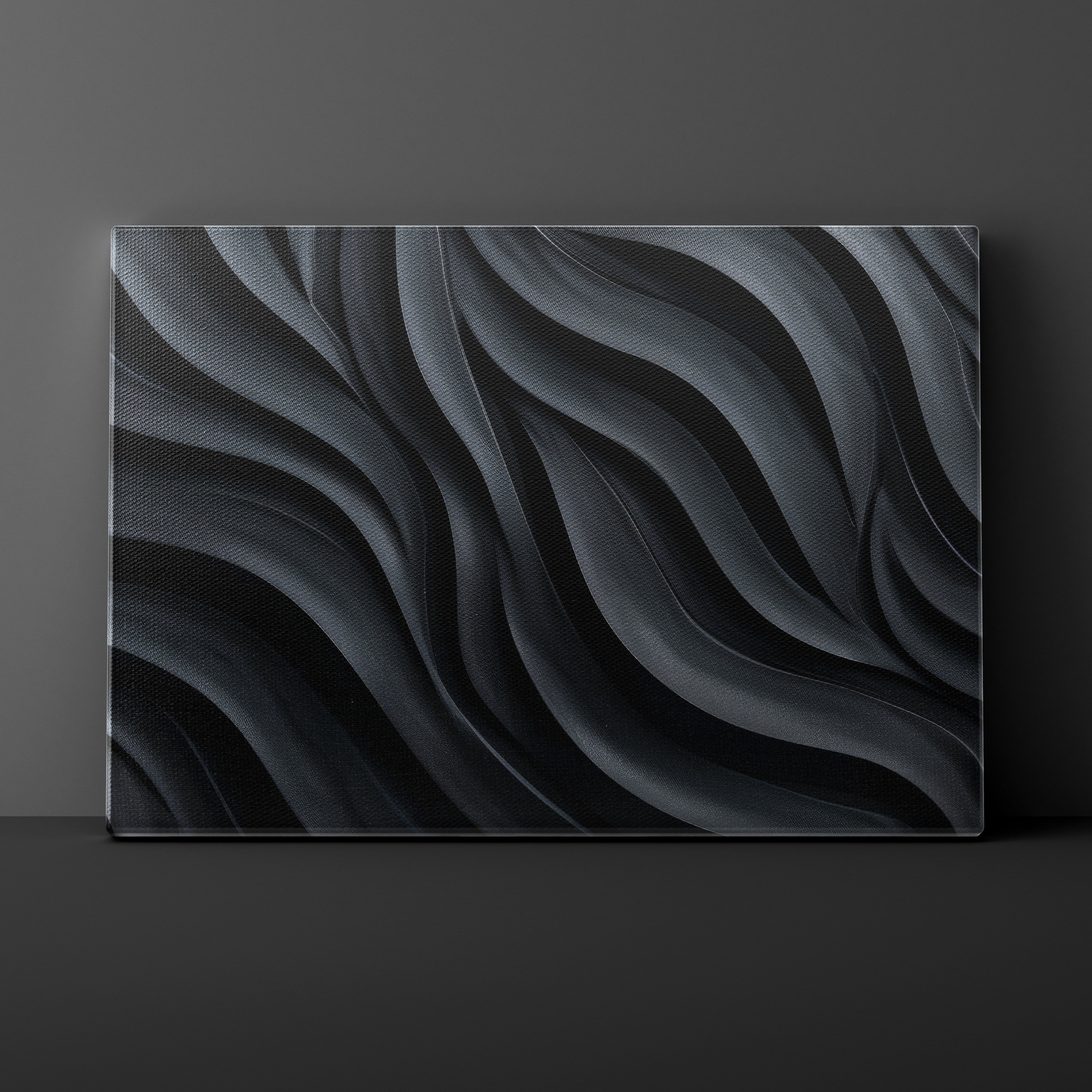 Abstract black and gray wavy pattern on a dark background