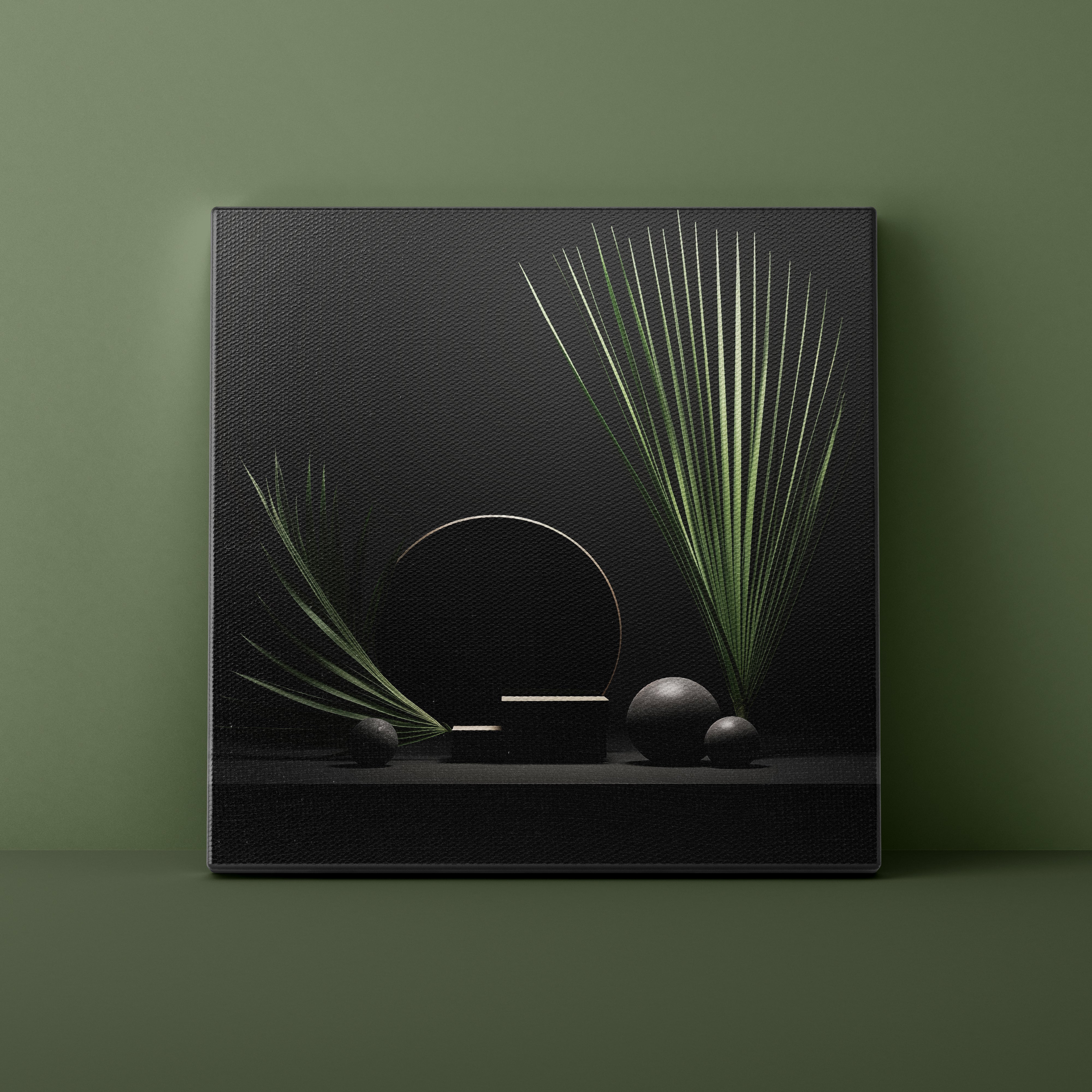 Framed artwork with green leaves and stones on a dark background against a green wall.